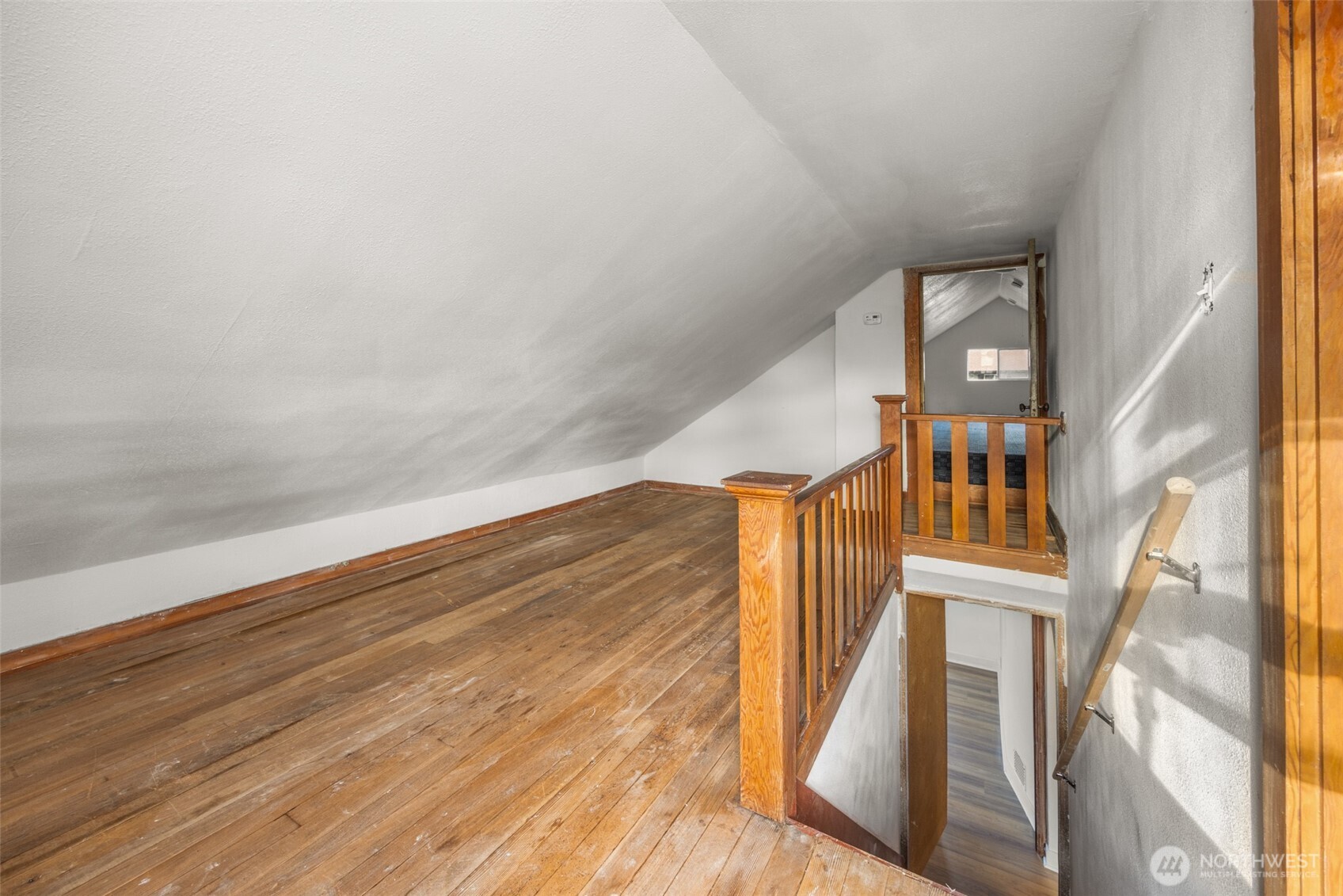 1624 Wright Avenue Sumner, WA 98390 - Photo 20 of 29 a view of staircase with white walls and wooden floor