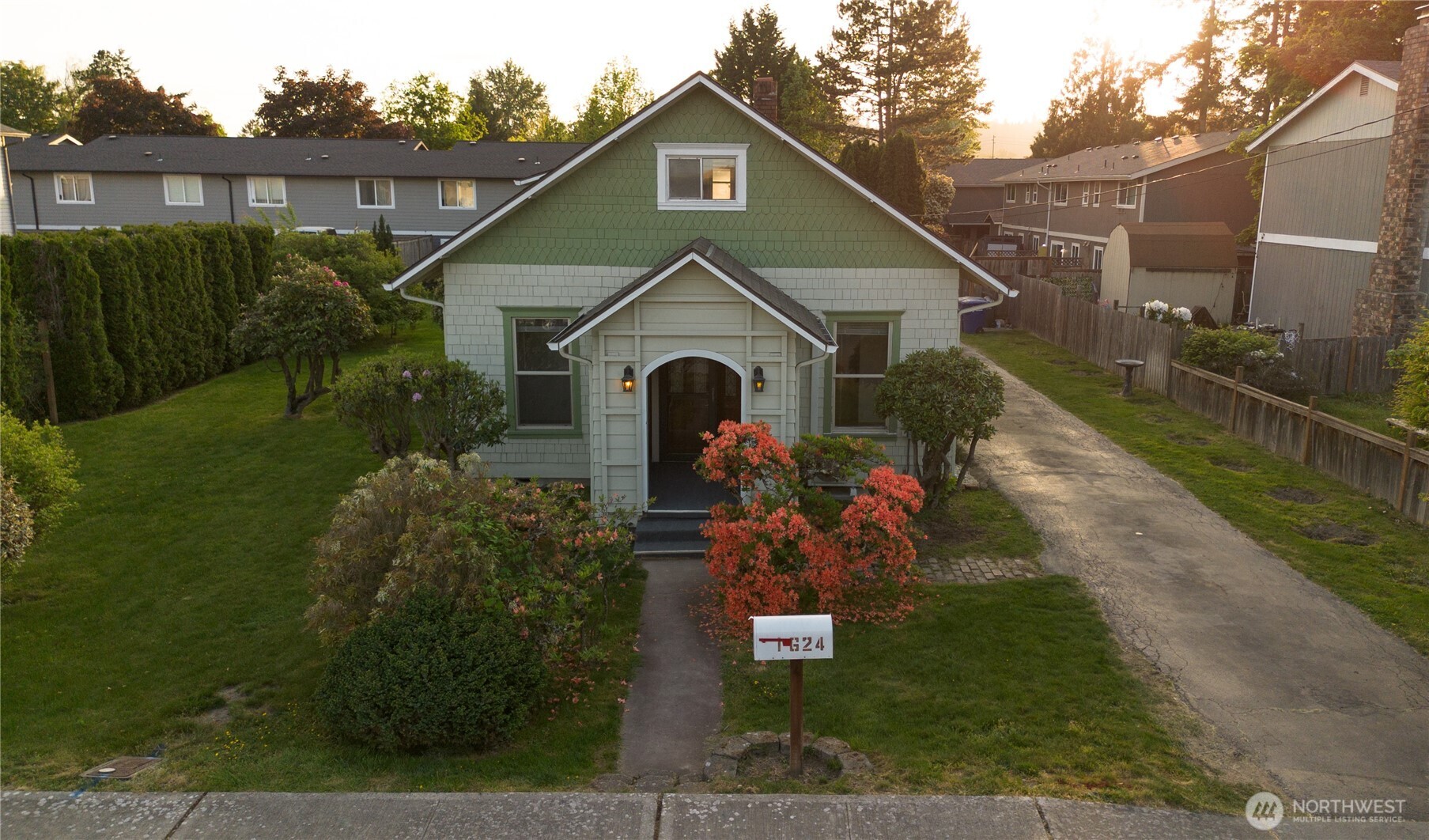 1624 Wright Avenue Sumner, WA 98390 - Photo 2 of 29 a front view of a house with garden