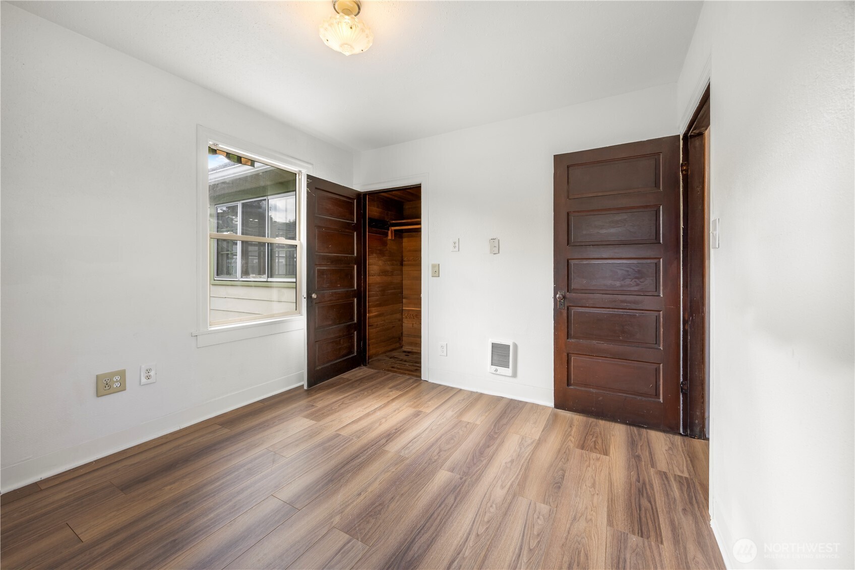 1624 Wright Avenue Sumner, WA 98390 - Photo 5 of 29 wooden floor in an empty room with a window