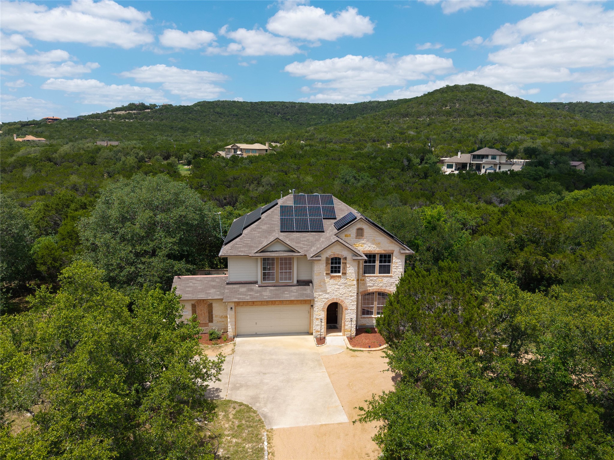 8122 Lime Creek Road Volente, TX 78641 - Photo 33 of 40 Aerial views show the Solar Panels with Tesla Powerwall 3 battery backup!