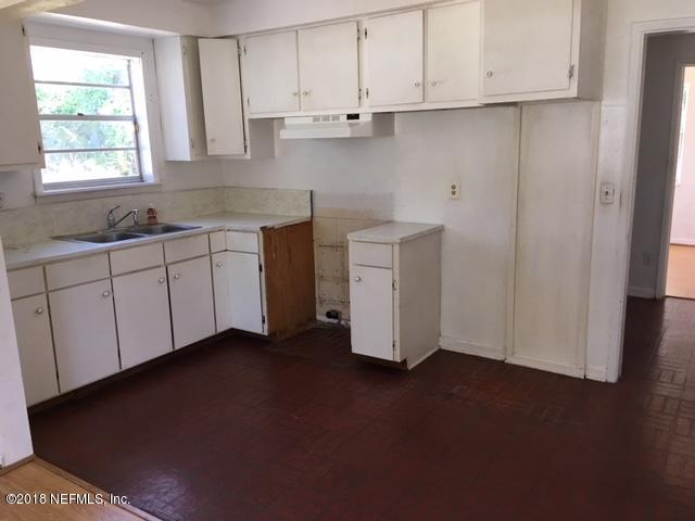 6019 Temple Road Jacksonville, FL 32217 - Photo 5 of 14 a kitchen with a sink and cabinets