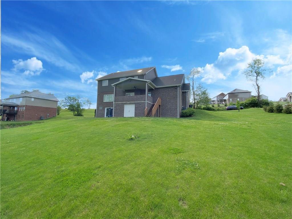 289 Durst Road Irwin, PA 15642 - Photo 2 of 25 VIEW OF HUGE REAR YARD. CONVENIENT STORAGE CENTER BELOWCOVERED CONCRETE PATIO