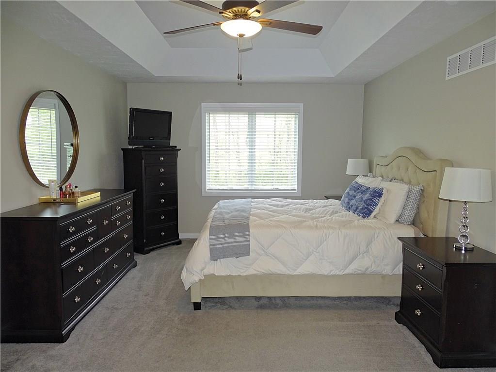 289 Durst Road Irwin, PA 15642 - Photo 18 of 25 MASTER BEDROOM WITH CEILING FAN AND TRAY CEILING