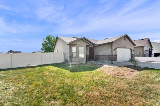 2575 Athena Drive Magna, UT 84044 - Photo 2 of 23 Single-story residence featuring light brown siding and a brick facade accent