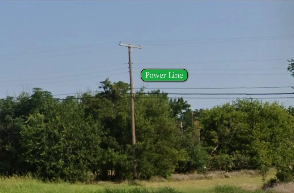 405-407 Flood Street Wichita Falls, TX 76301 - Photo 2 of 3 a green field with lots of trees in the background