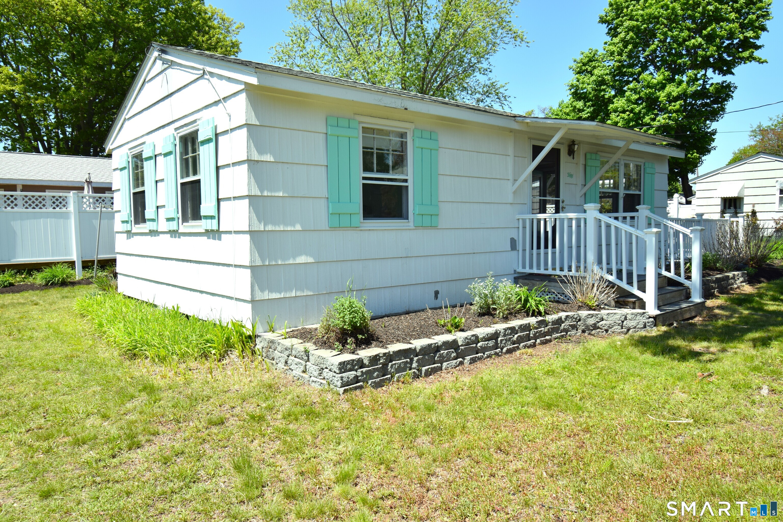 50 East Street Madison, CT 06443 - Photo 25 of 26 a front view of a house with a yard