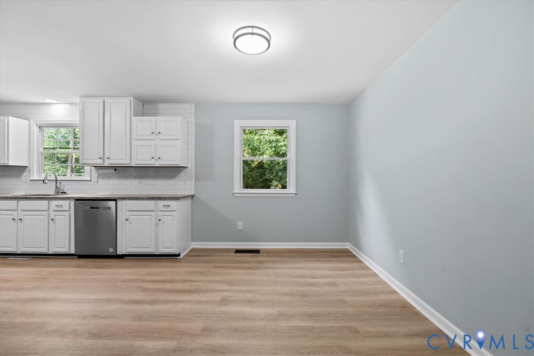 7010 Slate Road Chesterfield, VA 23832 - Photo 36 of 45 Kitchen area featuring white shaker cabinetry, sta