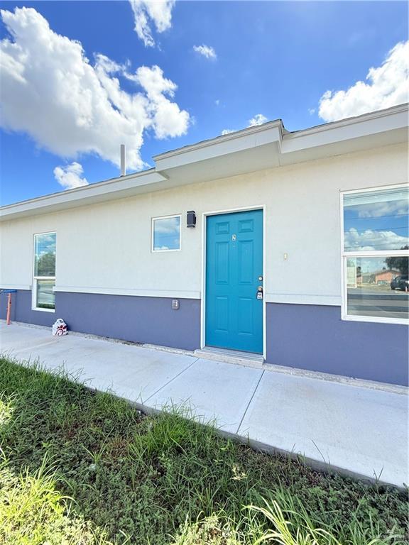 a view of an empty room with a fireplace