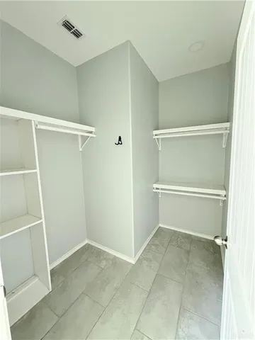 a bathroom with a toilet sink and shower