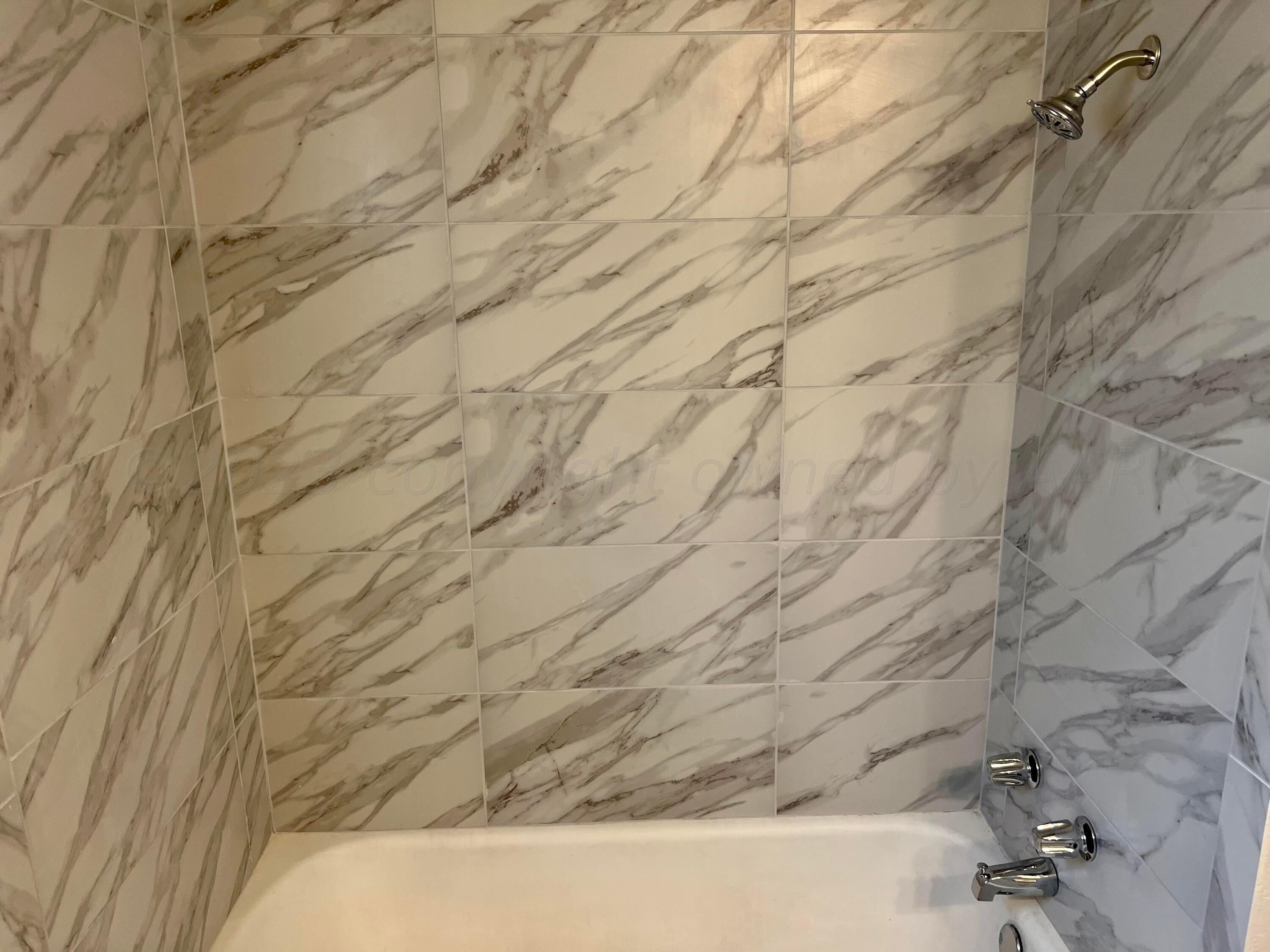 2903 Bagarry Street Amarillo, TX 79103 - Photo 16 of 26 a bathroom with a bathtub