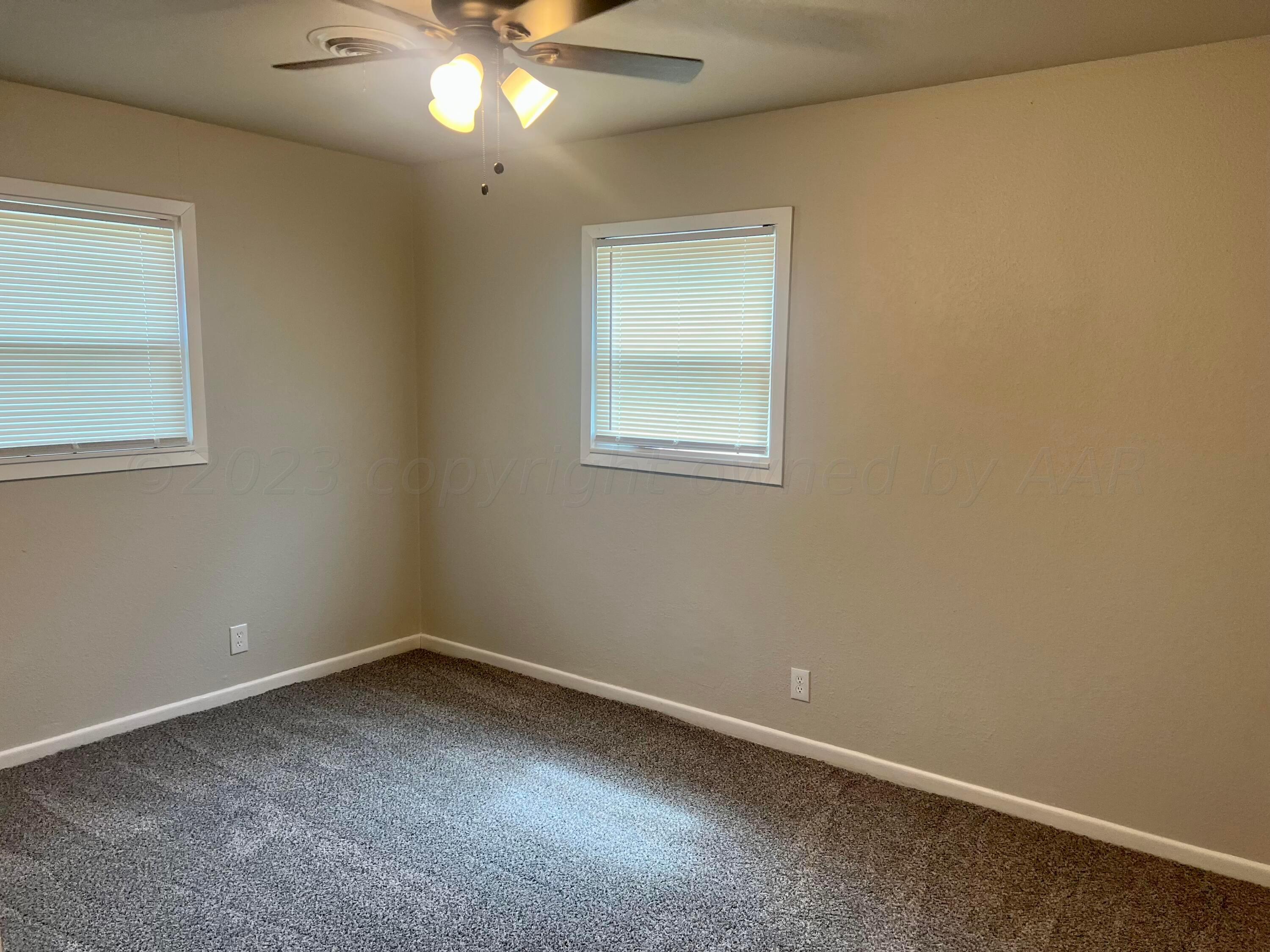 2903 Bagarry Street Amarillo, TX 79103 - Photo 21 of 26 an empty room with a window