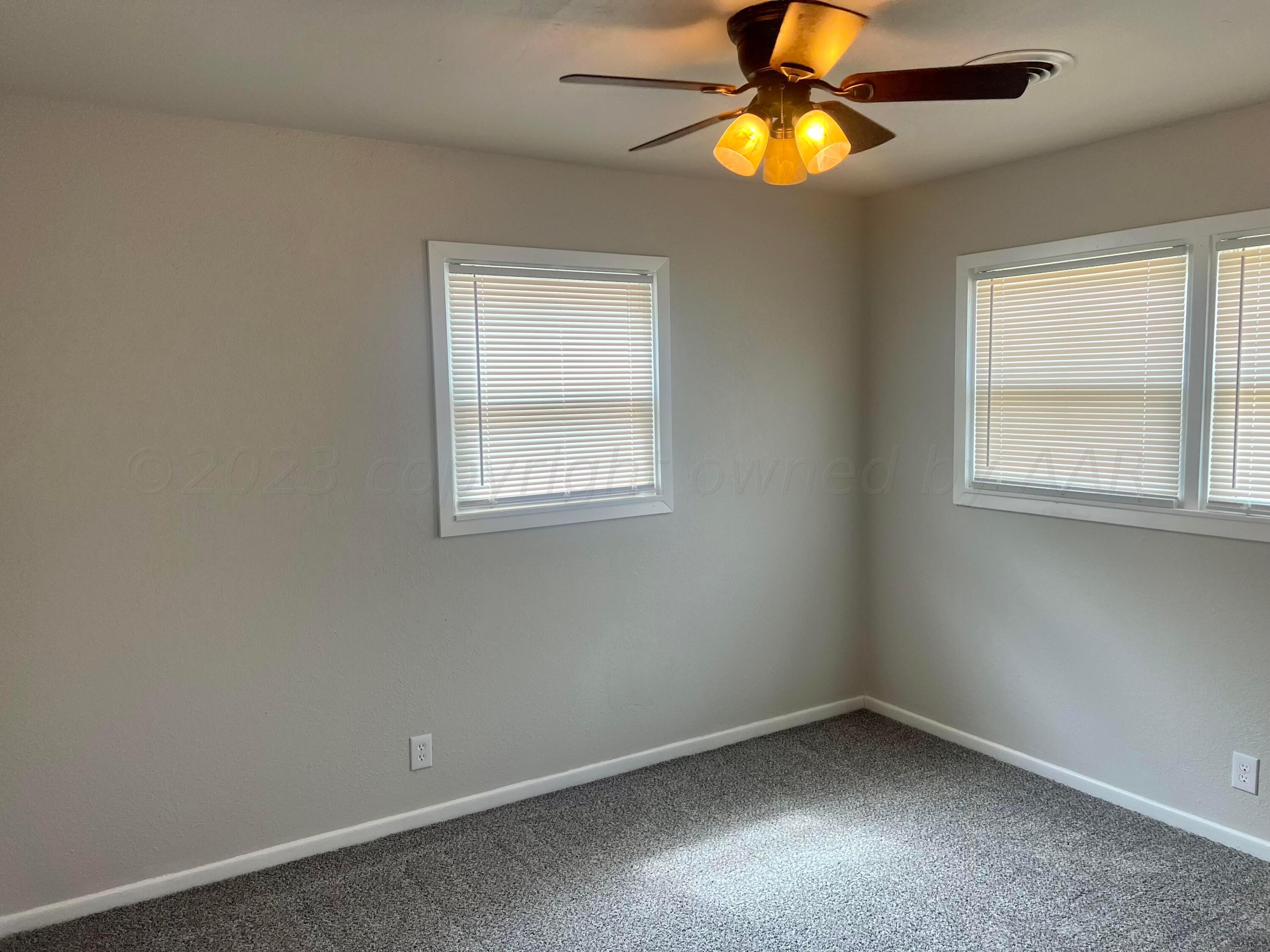 2903 Bagarry Street Amarillo, TX 79103 - Photo 22 of 26 an empty room with a window