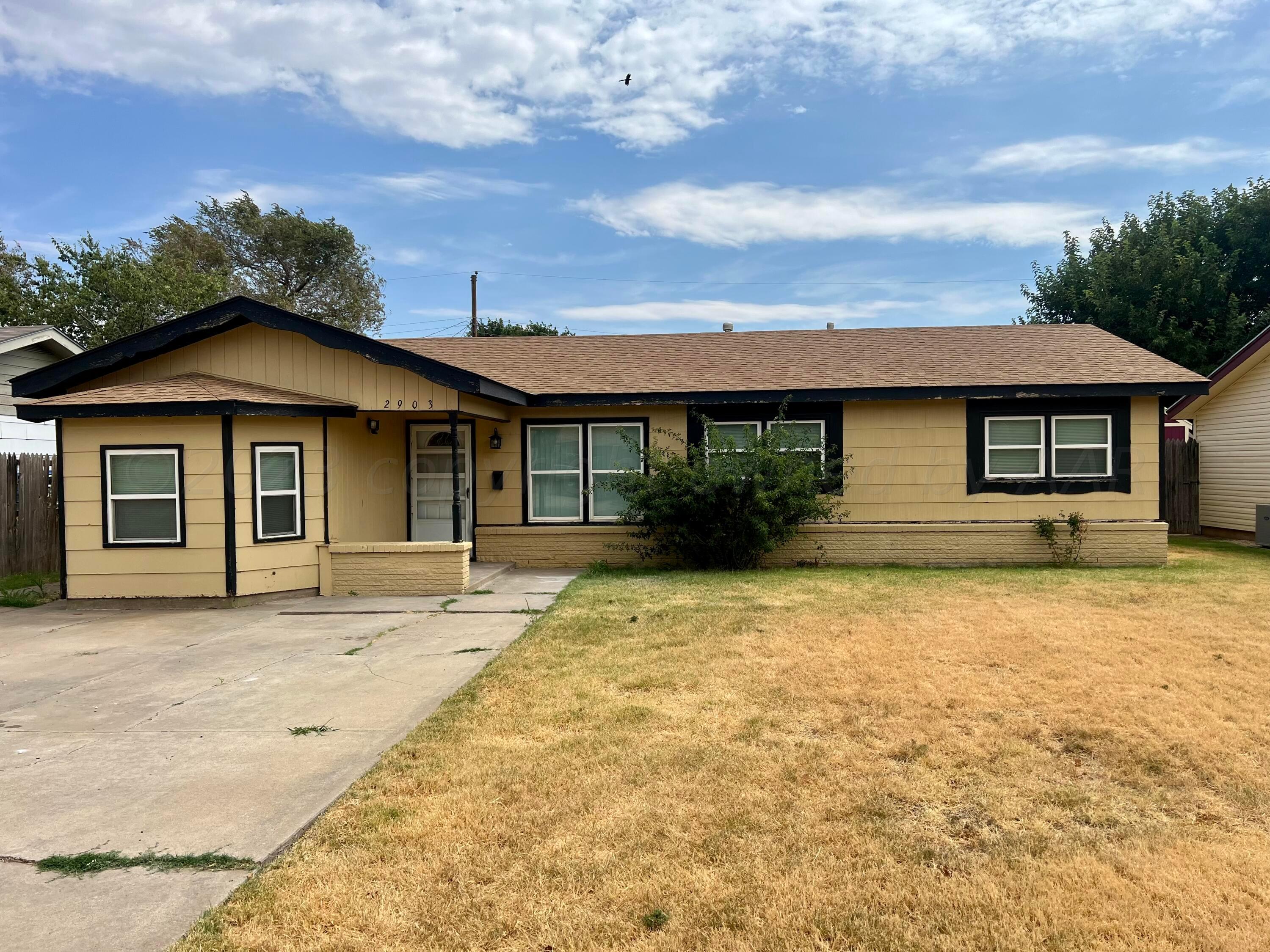 2903 Bagarry Street Amarillo, TX 79103 - Photo 8 of 26 front view of a house with a yard