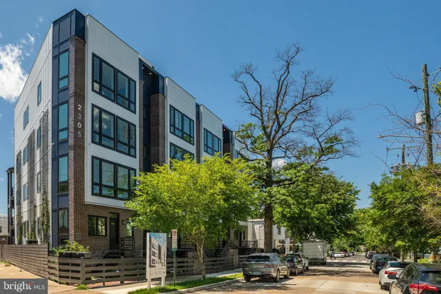 a view of a street with houses