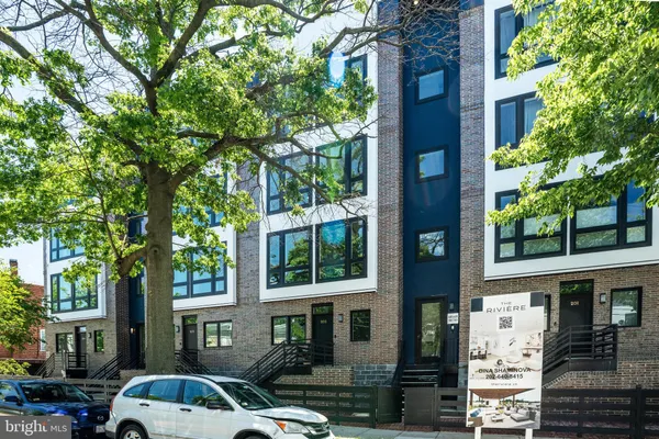 a front view of a building with street view