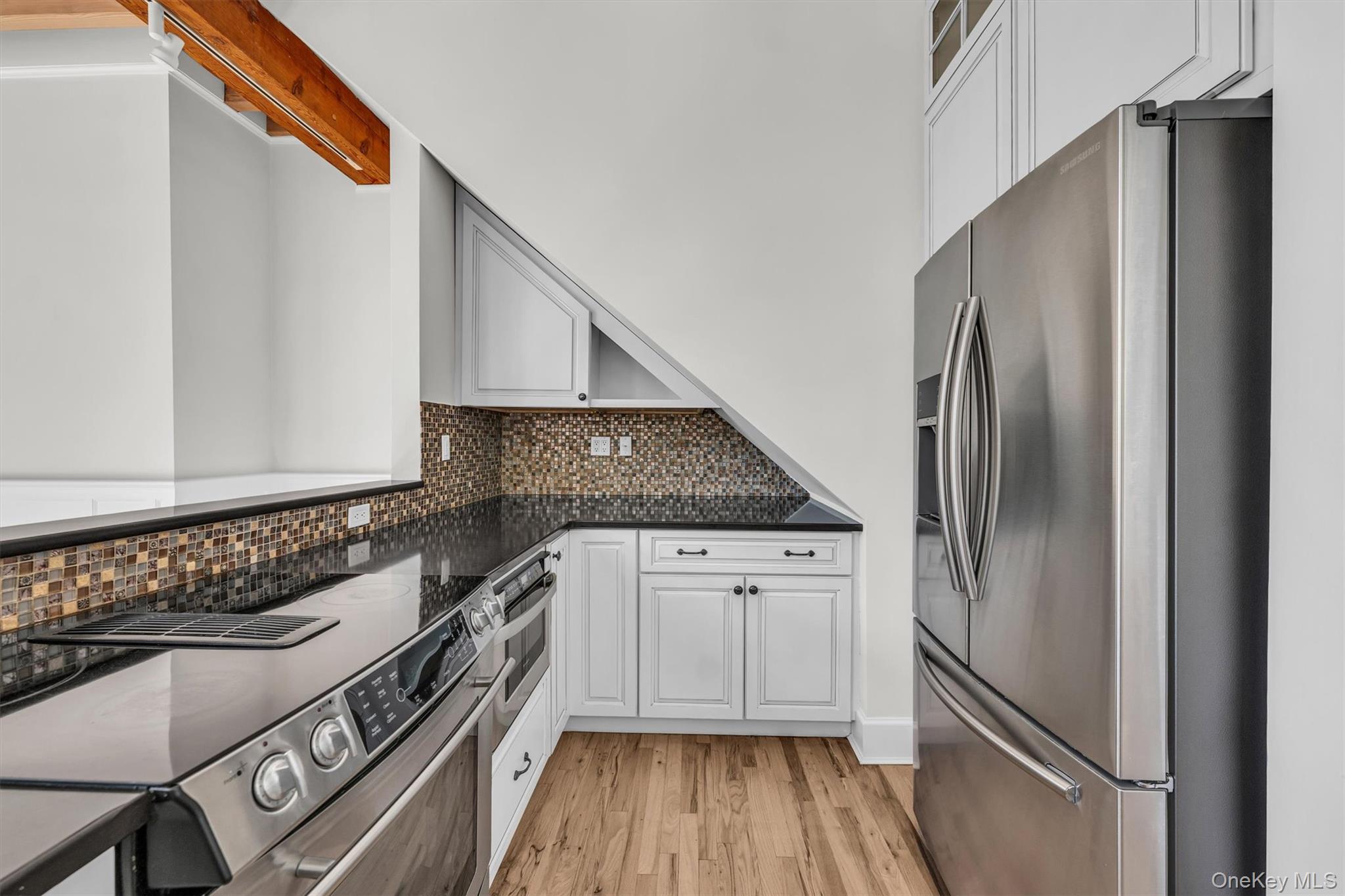 238 Beaver Dam Road Brookhaven, NY 11719 - Photo 17 of 44 a kitchen with granite countertop a refrigerator stove and sink