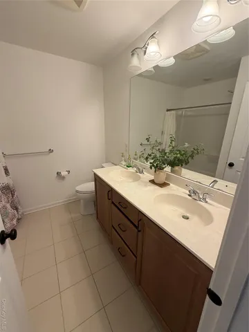 a bathroom with a sink a vanity and a mirror