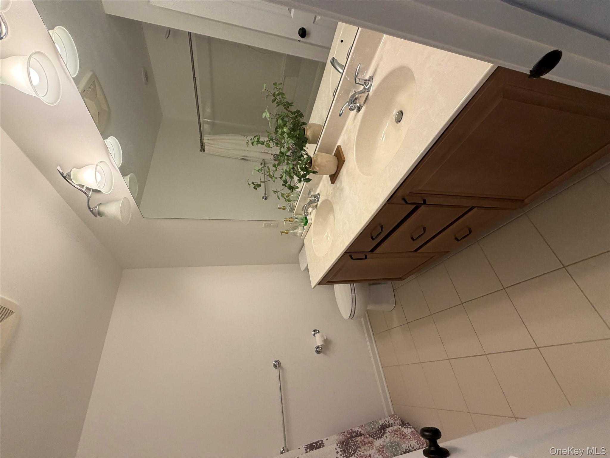 45 Lewis Road Hopewell Junction, NY 12533 - Photo 13 of 34 a bathroom with a sink a vanity and a mirror