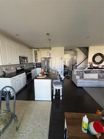 a room with lots of chairs and a projector screen