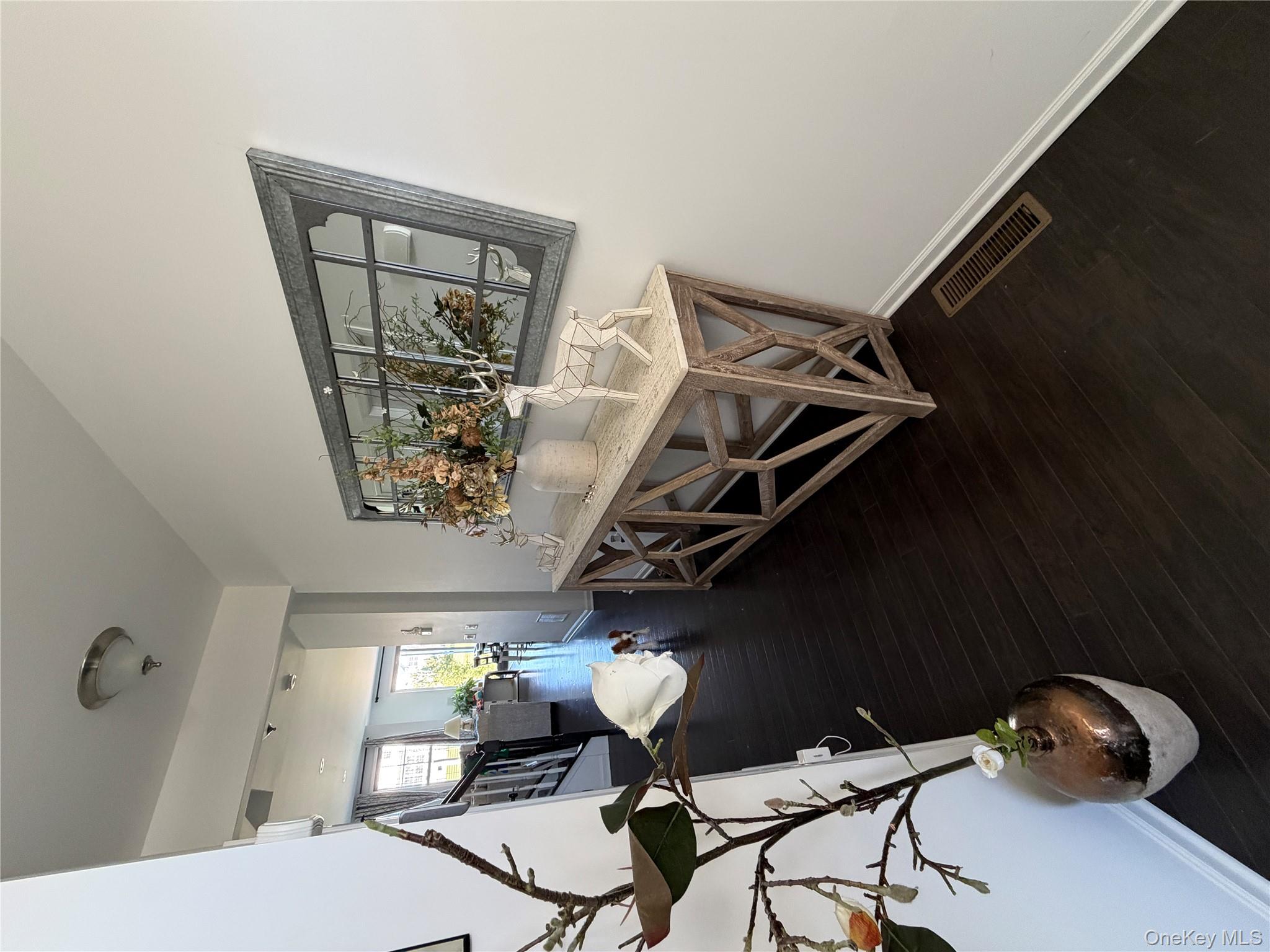 45 Lewis Road Hopewell Junction, NY 12533 - Photo 20 of 34 a living room with a table chairs and wooden floor