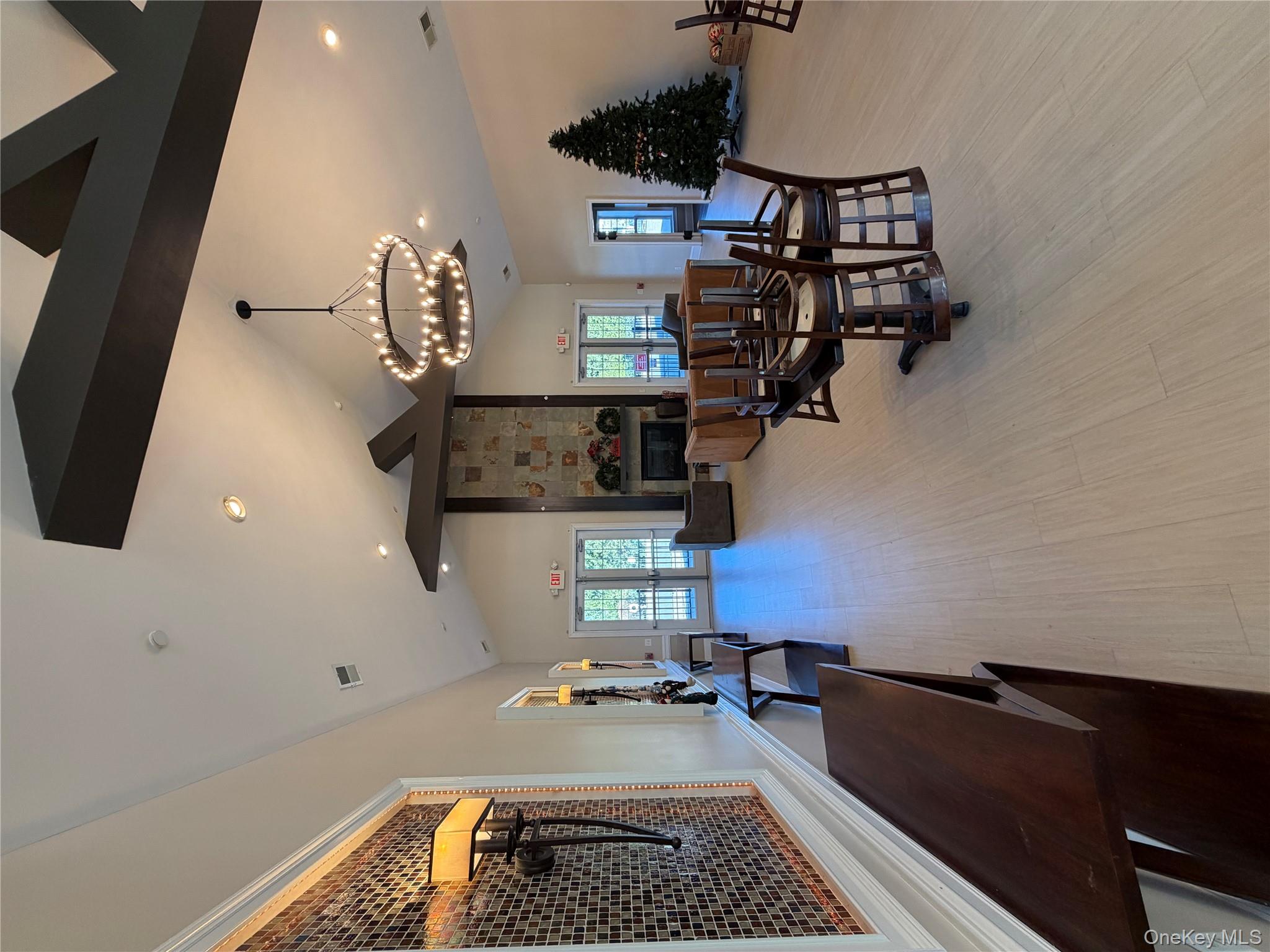 45 Lewis Road Hopewell Junction, NY 12533 - Photo 28 of 34 a living room with furniture and a chandelier