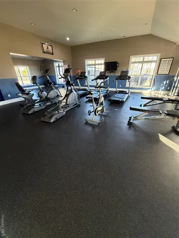 a view of a studio with wooden floor