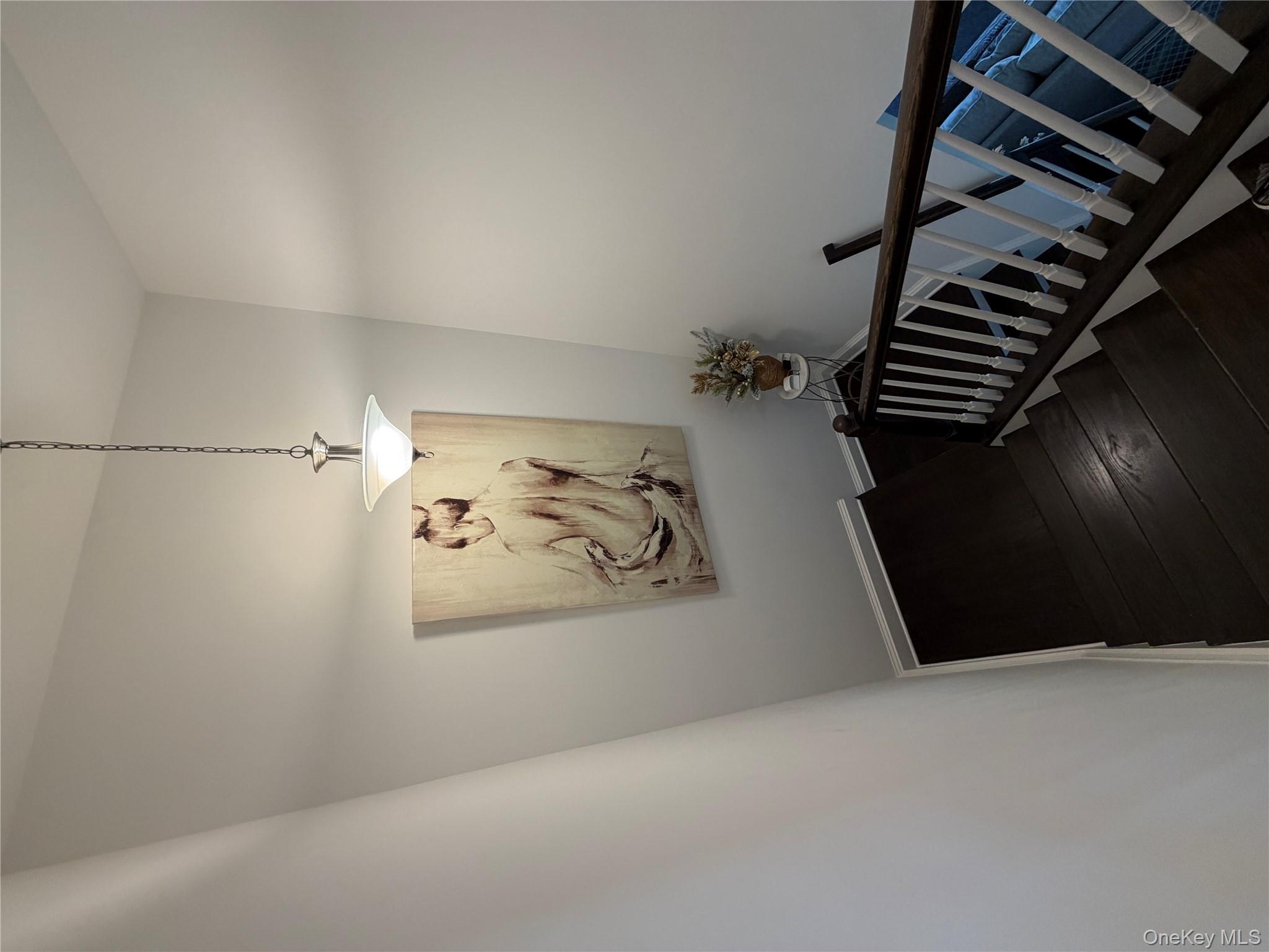 45 Lewis Road Hopewell Junction, NY 12533 - Photo 7 of 34 a view of a hallway with a chandelier