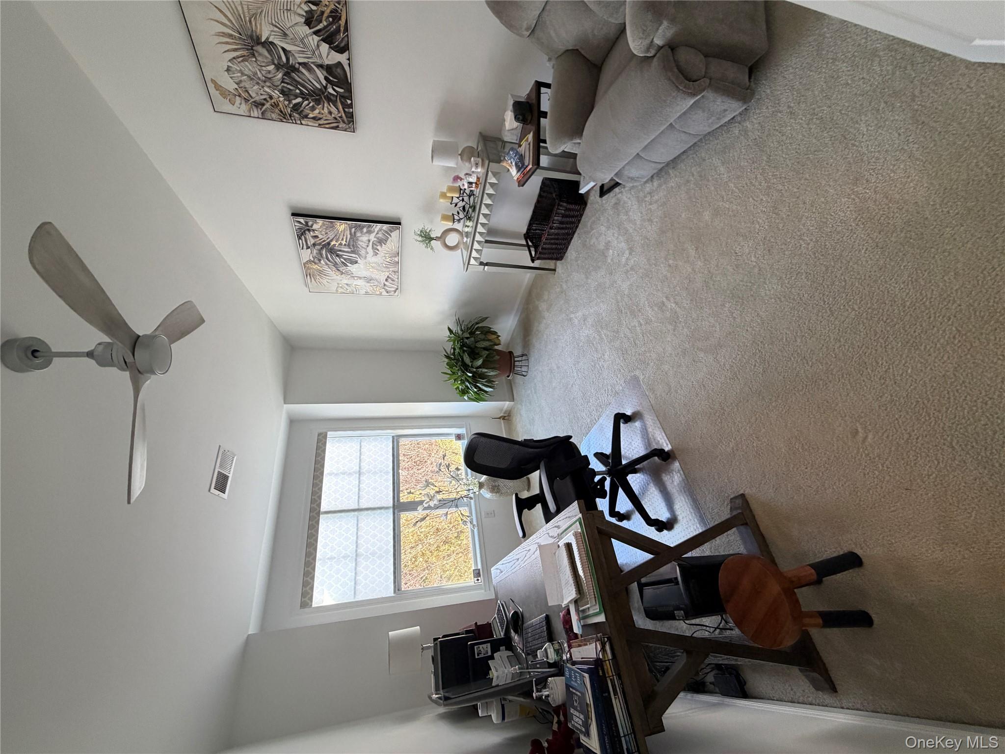 45 Lewis Road Hopewell Junction, NY 12533 - Photo 9 of 34 a view of a livingroom with workspace and a window
