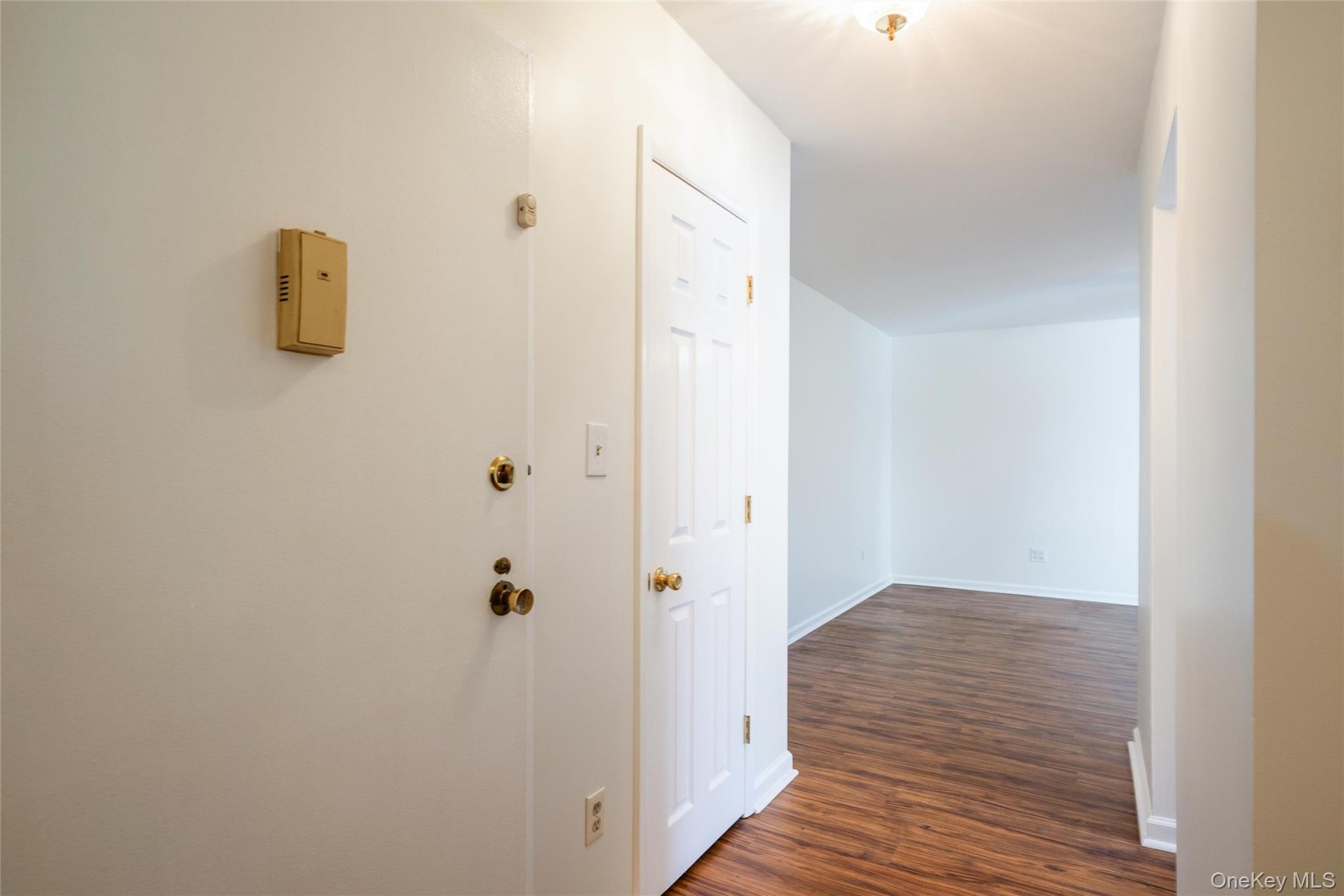 460 Old Town Road, Unit 20F Port Jefferson Station, NY 11776 - Photo 11 of 22 a view of a hallway with wooden floor