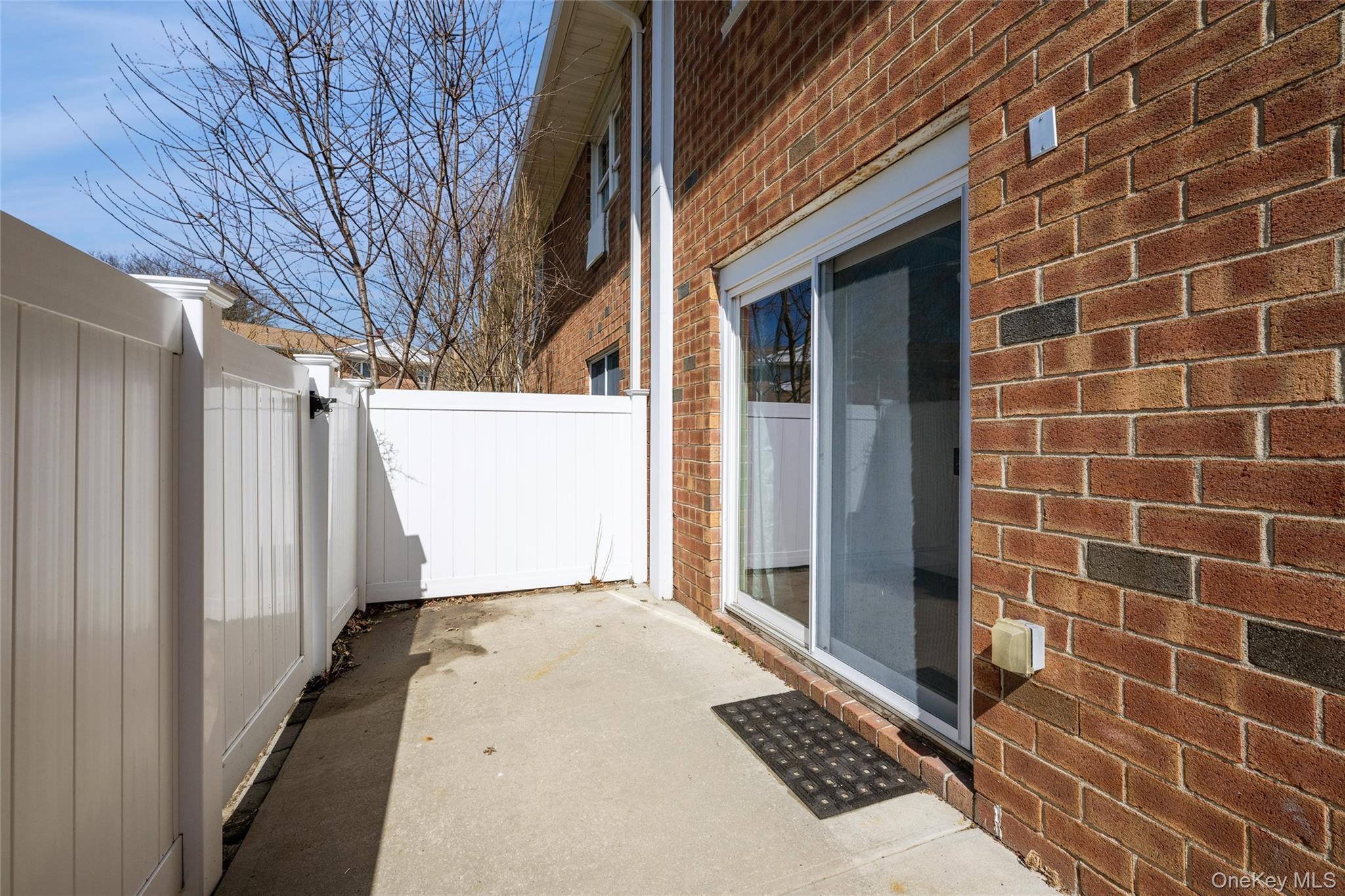 460 Old Town Road, Unit 20F Port Jefferson Station, NY 11776 - Photo 14 of 22 a view of a brick house with a street