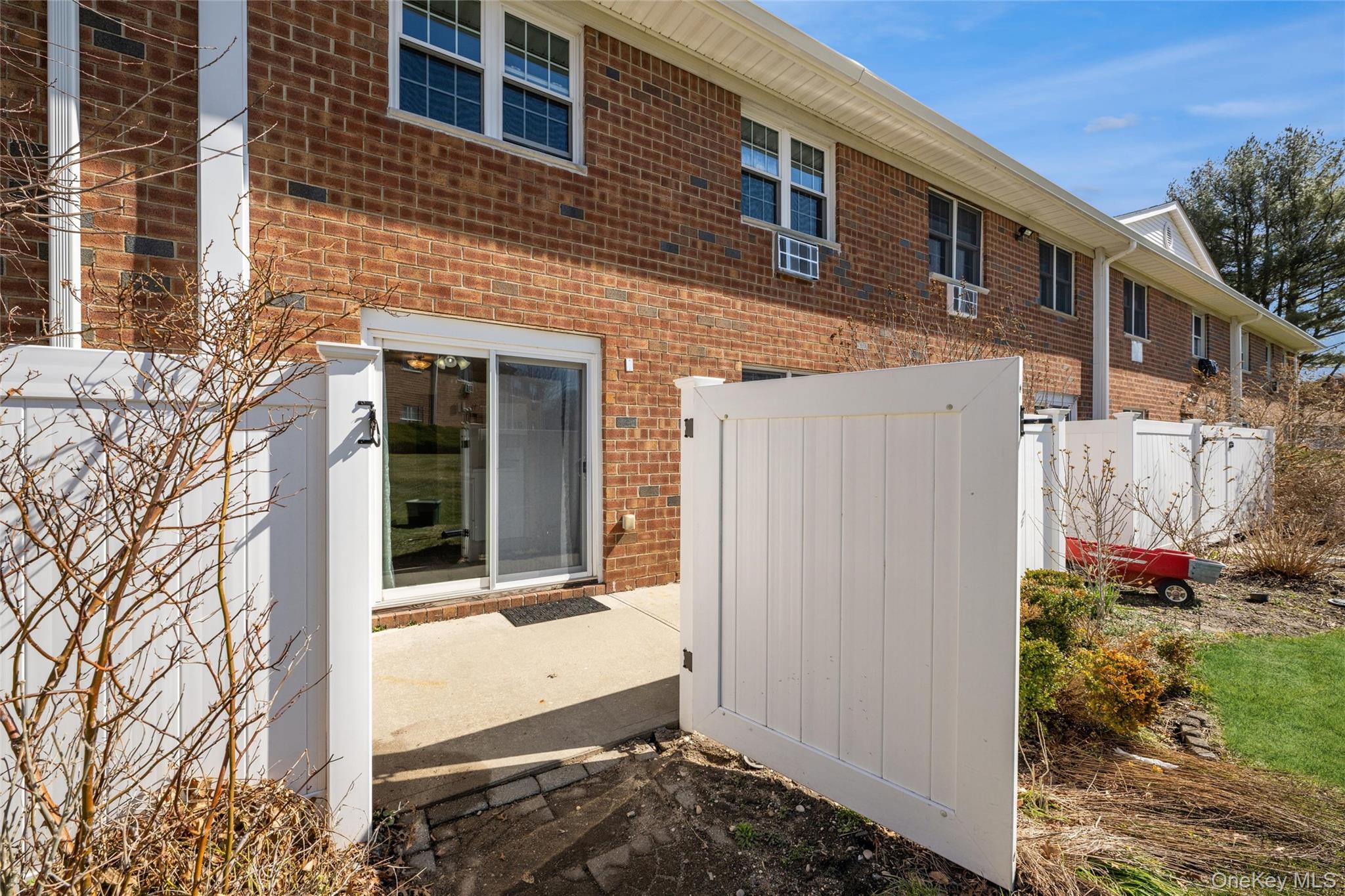 460 Old Town Road, Unit 20F Port Jefferson Station, NY 11776 - Photo 15 of 22 a view of small house with yard