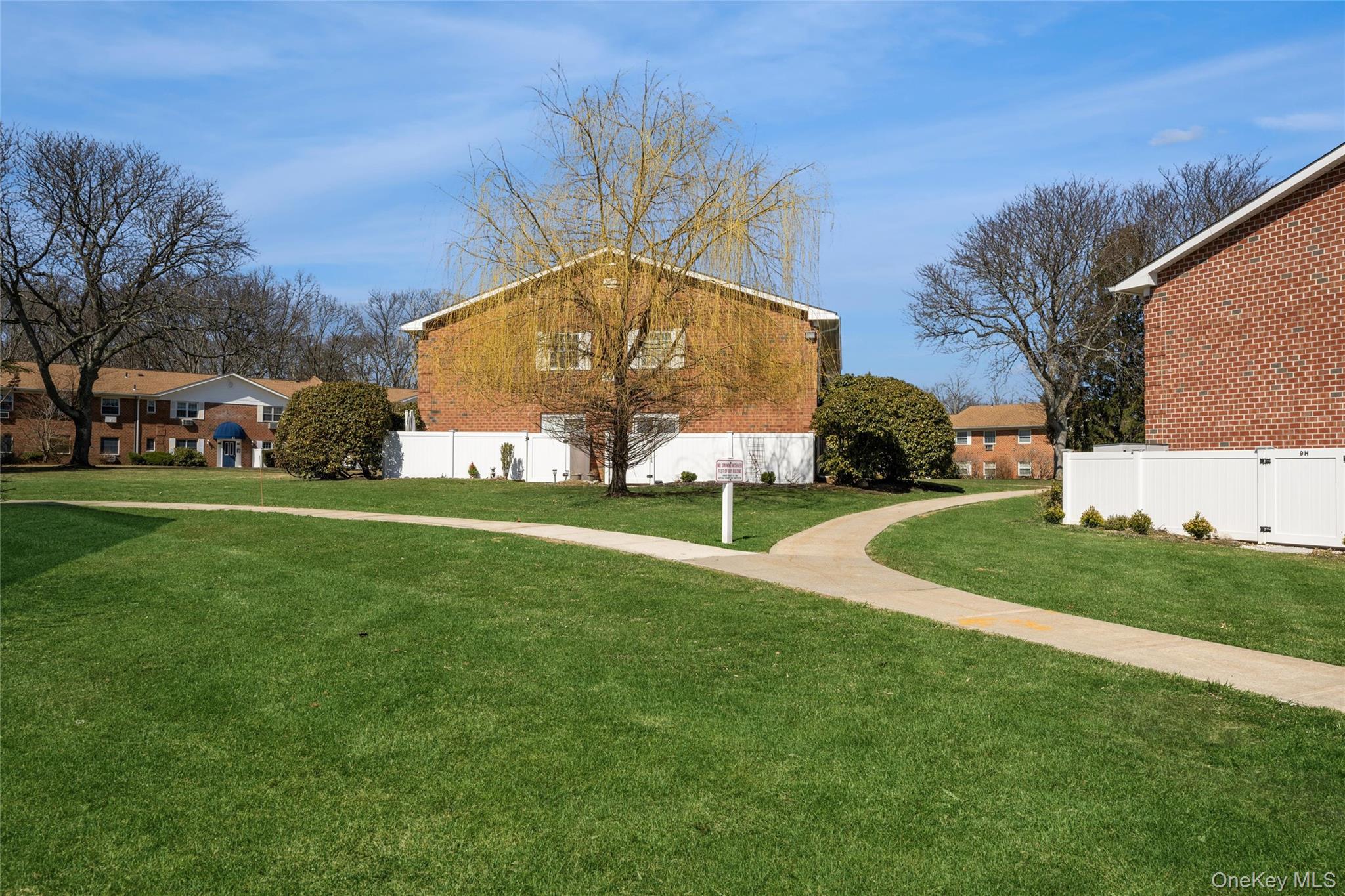 460 Old Town Road, Unit 20F Port Jefferson Station, NY 11776 - Photo 16 of 22 a view of a house with a backyard