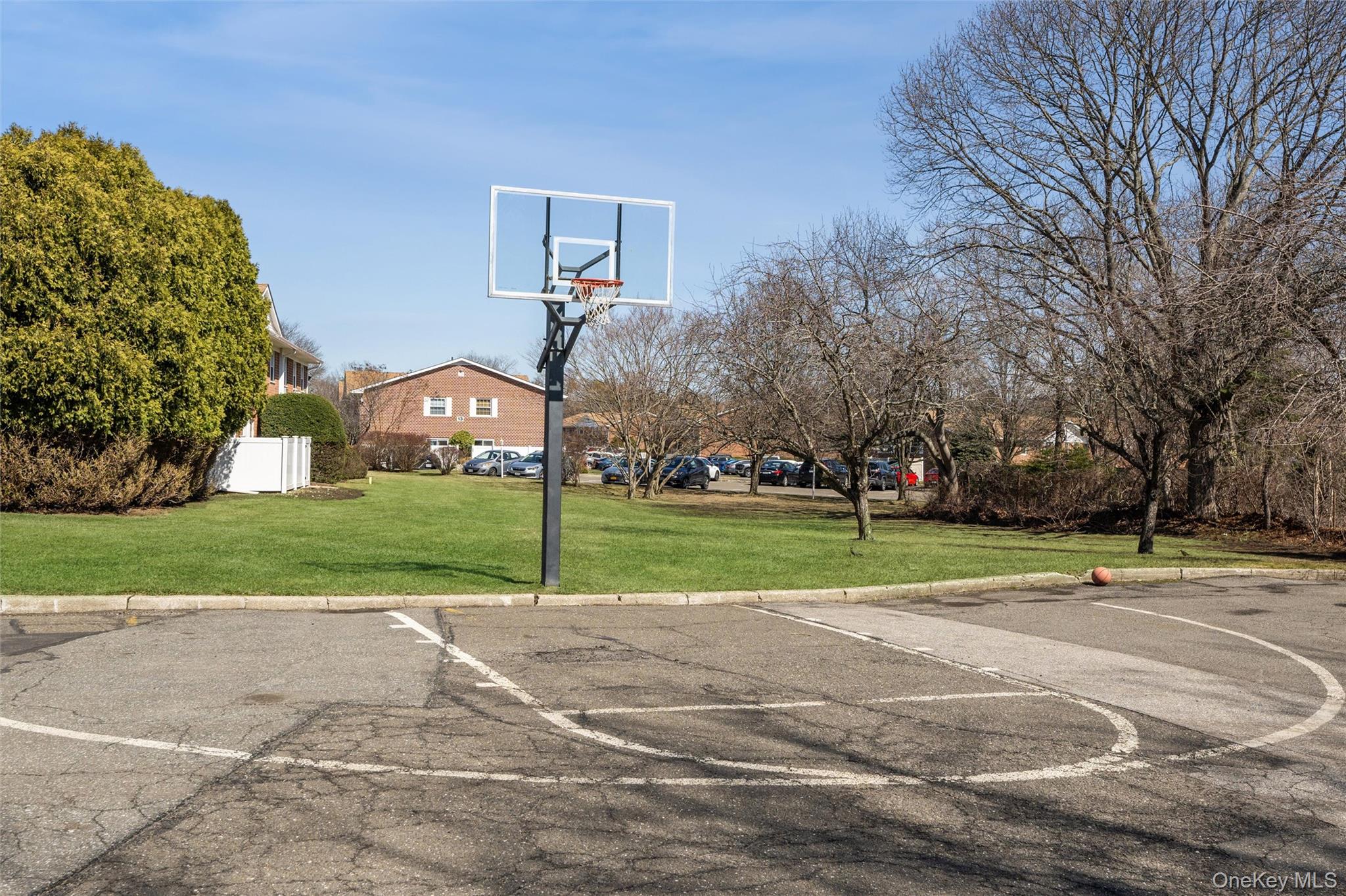 460 Old Town Road, Unit 20F Port Jefferson Station, NY 11776 - Photo 17 of 22 a view of a playground with basketball court