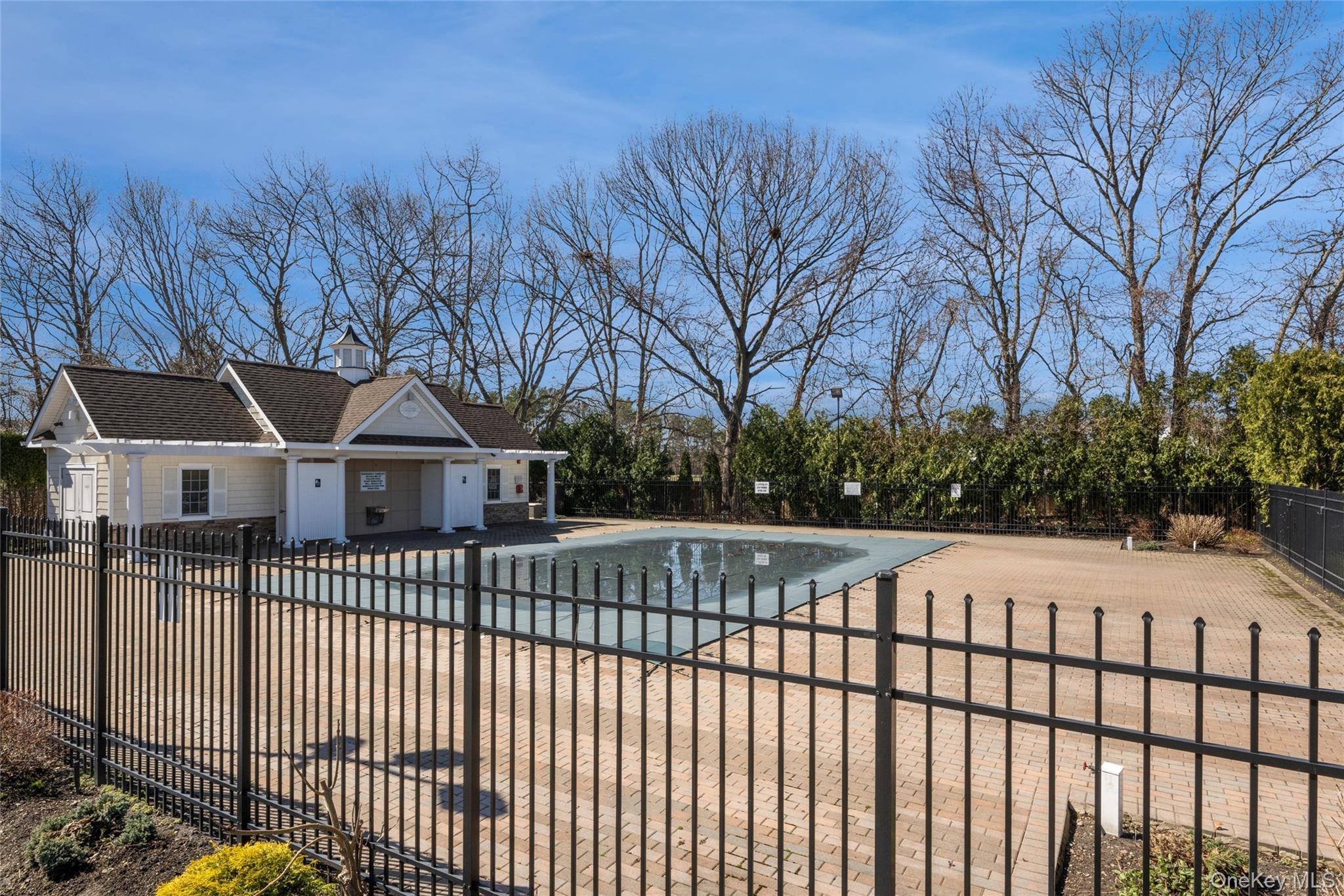 460 Old Town Road, Unit 20F Port Jefferson Station, NY 11776 - Photo 19 of 22 a view of a house with a wooden fence