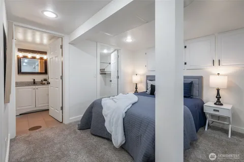 a bed room with a bed and furniture