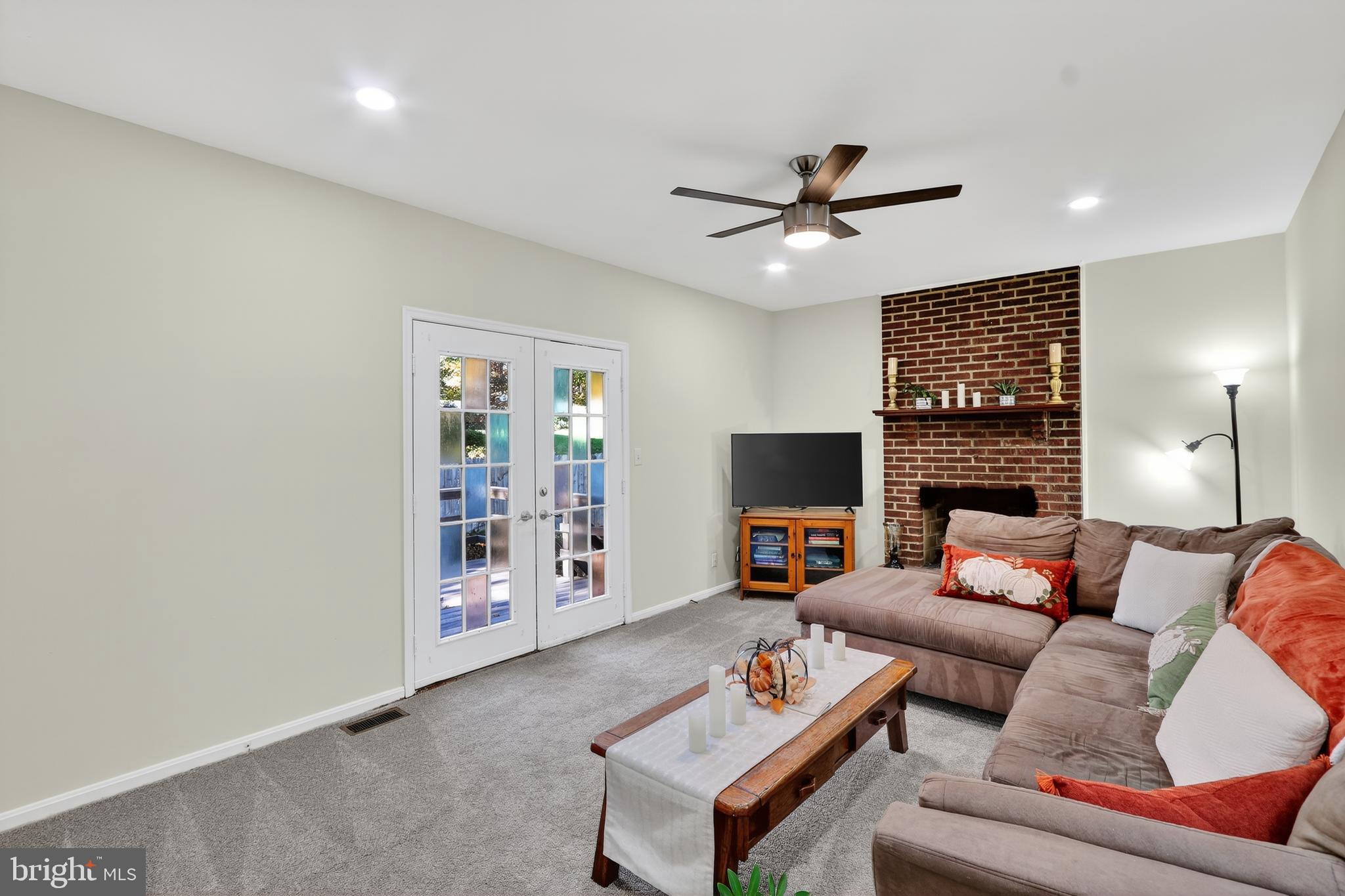 111 Oaklawn Road Stafford, VA 22554 - Photo 13 of 50 a living room with furniture and a fireplace