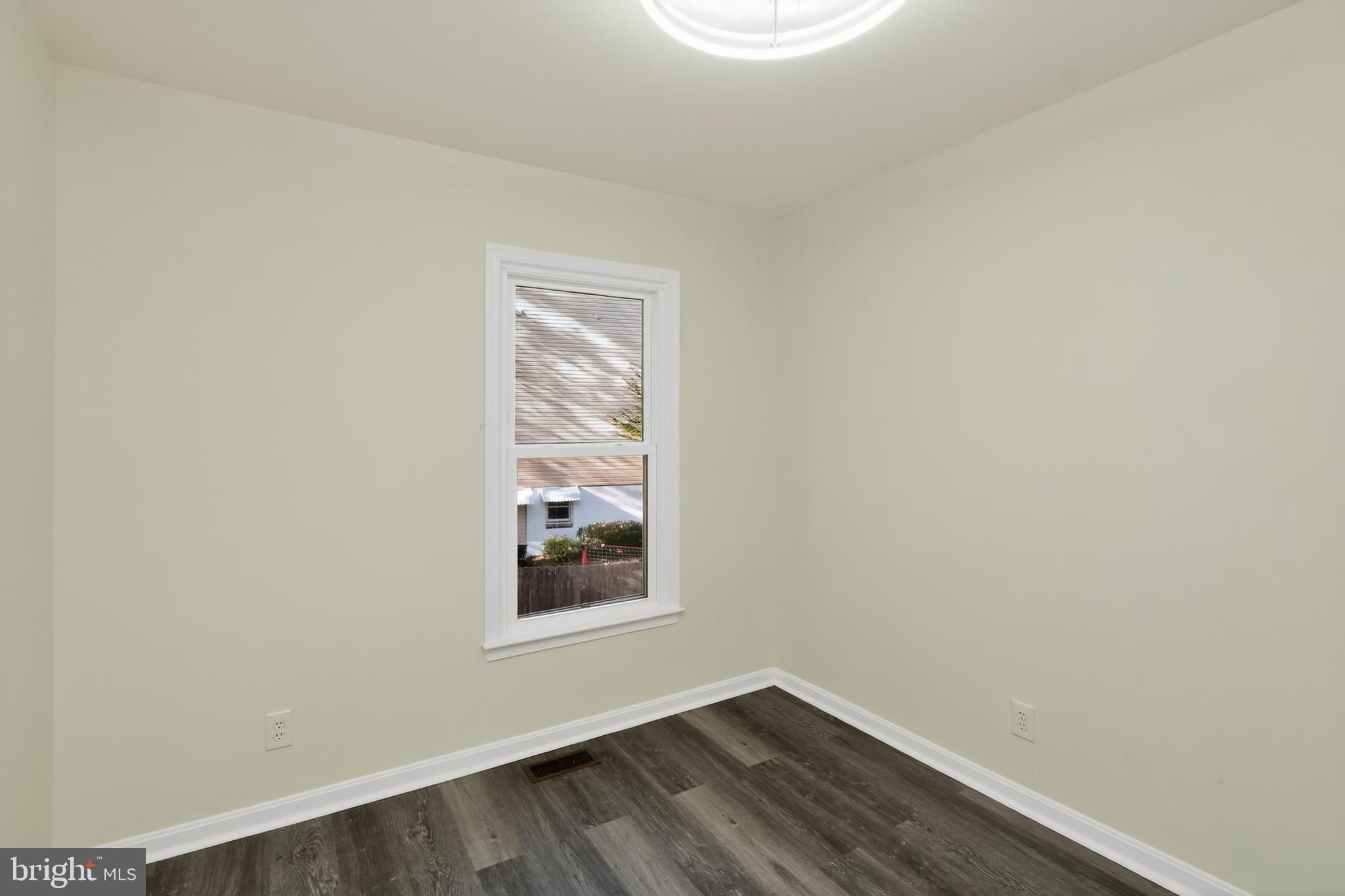 111 Oaklawn Road Stafford, VA 22554 - Photo 14 of 50 a view of an empty room with wooden floor and a window