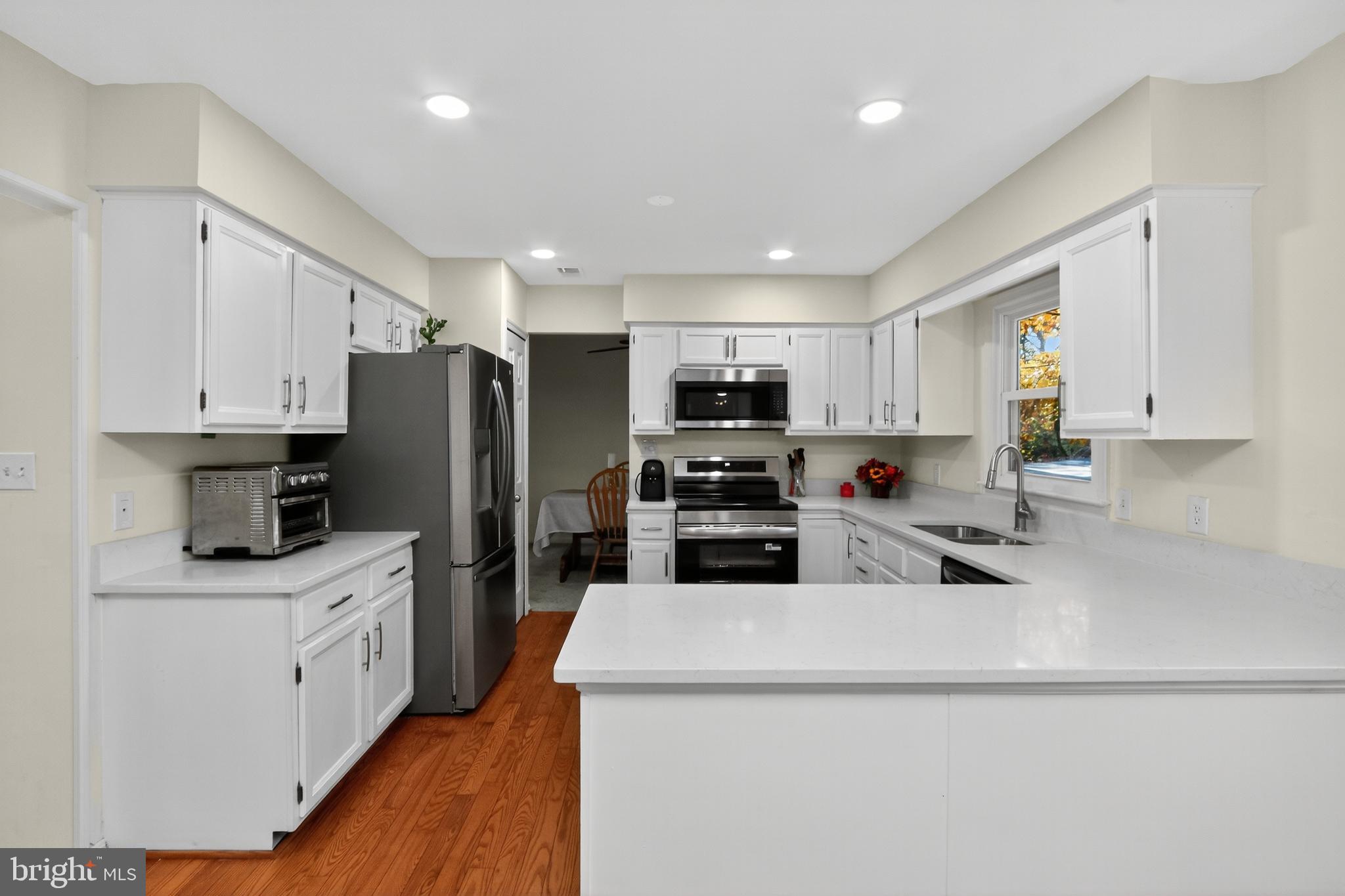 111 Oaklawn Road Stafford, VA 22554 - Photo 19 of 50 a kitchen with stainless steel appliances a refrigerator sink and microwave