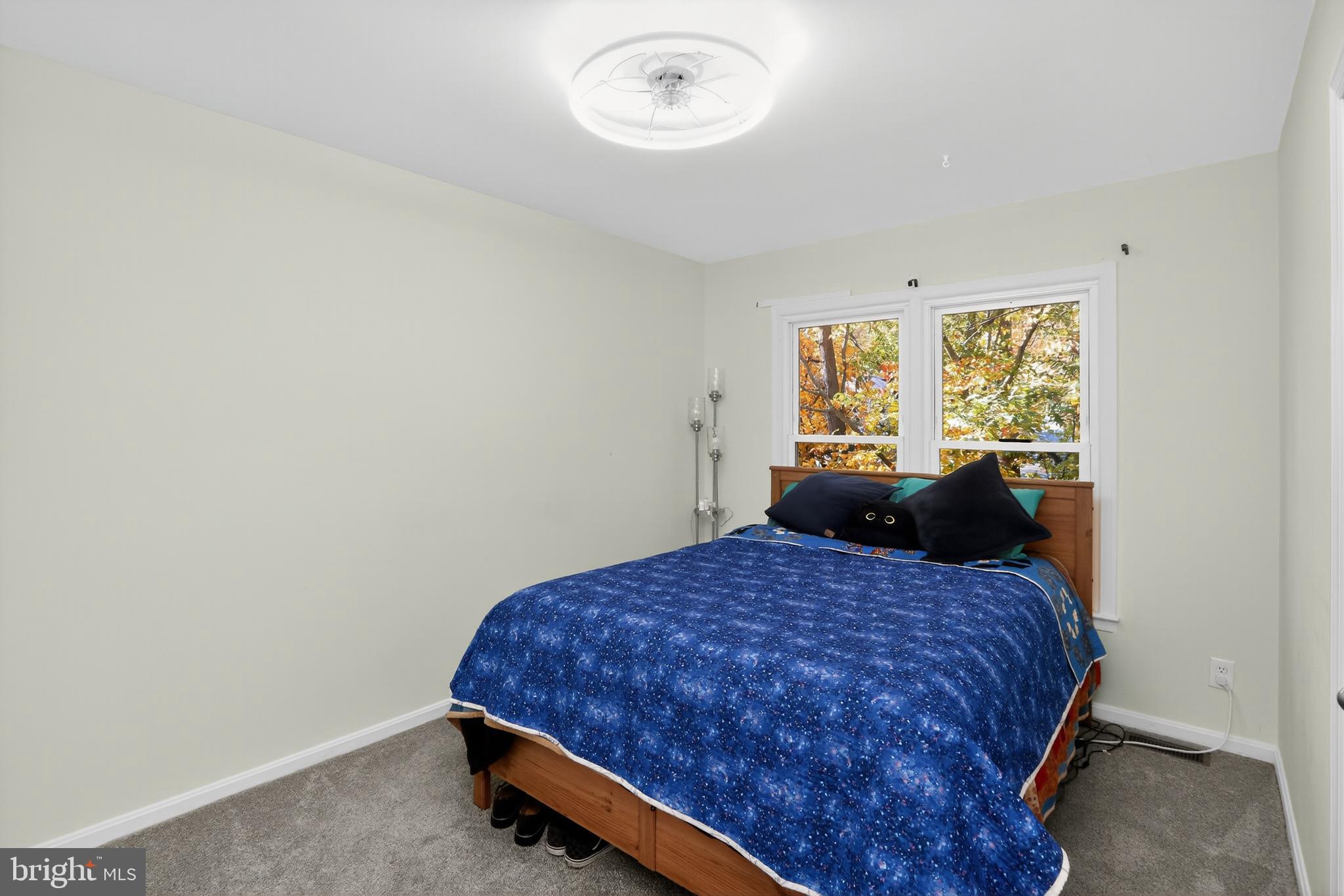 111 Oaklawn Road Stafford, VA 22554 - Photo 27 of 50 a bed sitting in a bedroom next to a window