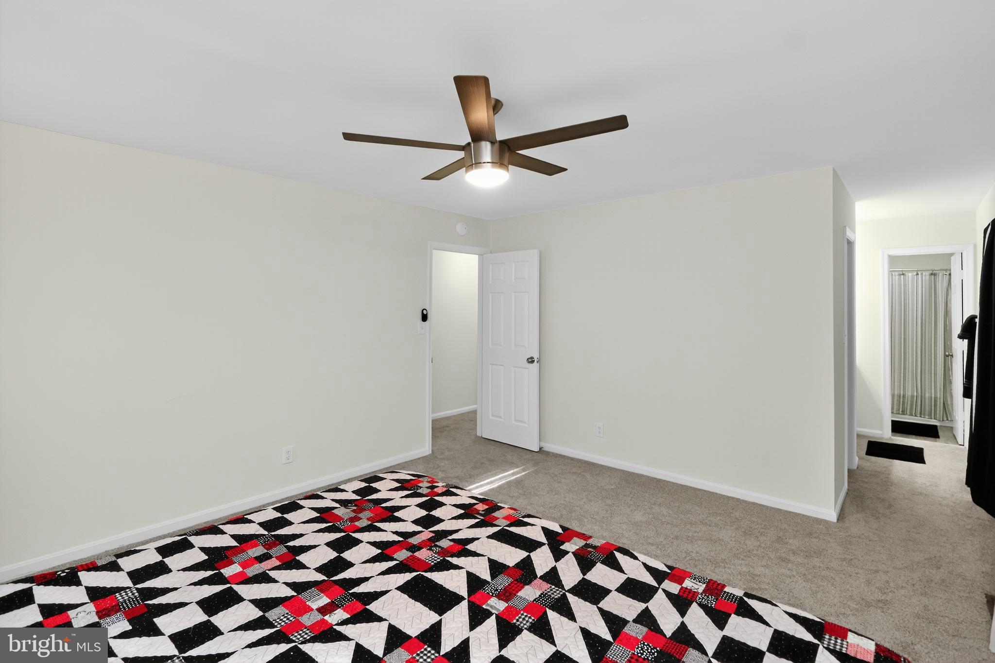 111 Oaklawn Road Stafford, VA 22554 - Photo 31 of 50 a bedroom with a bed and a chandelier