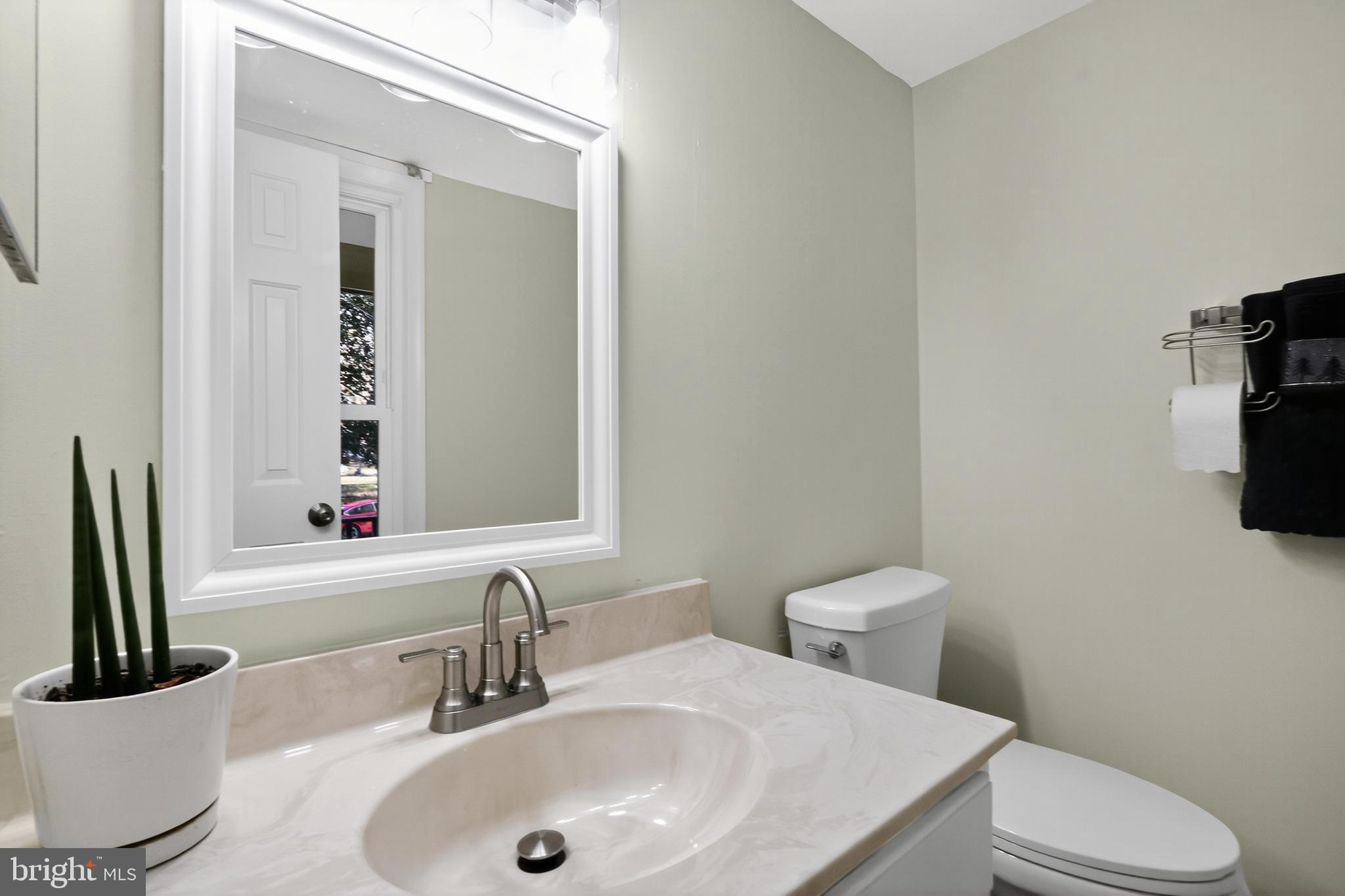 111 Oaklawn Road Stafford, VA 22554 - Photo 38 of 50 a bathroom with a toilet a sink and mirror