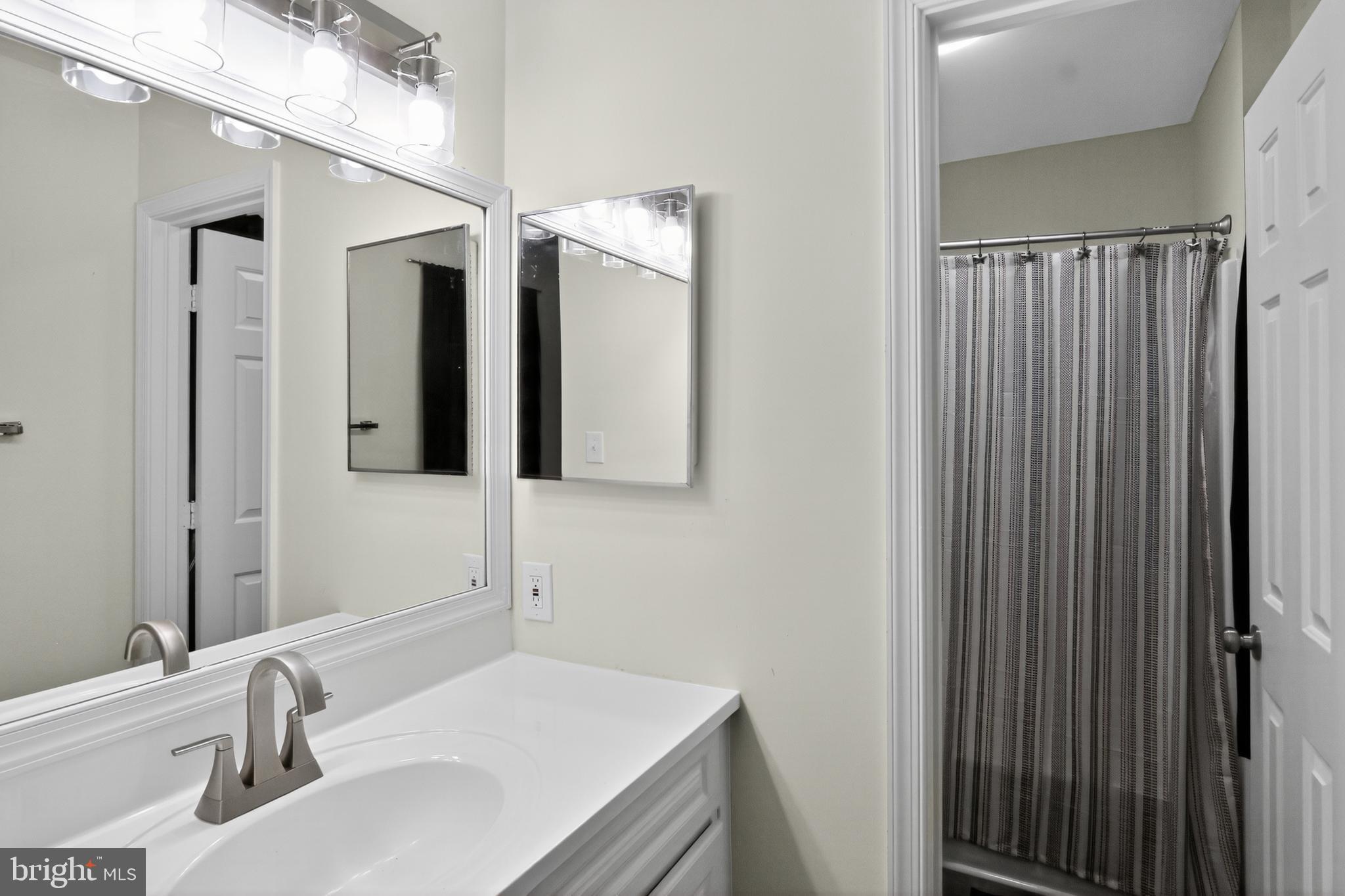 111 Oaklawn Road Stafford, VA 22554 - Photo 40 of 50 a bathroom with a sink and a mirror