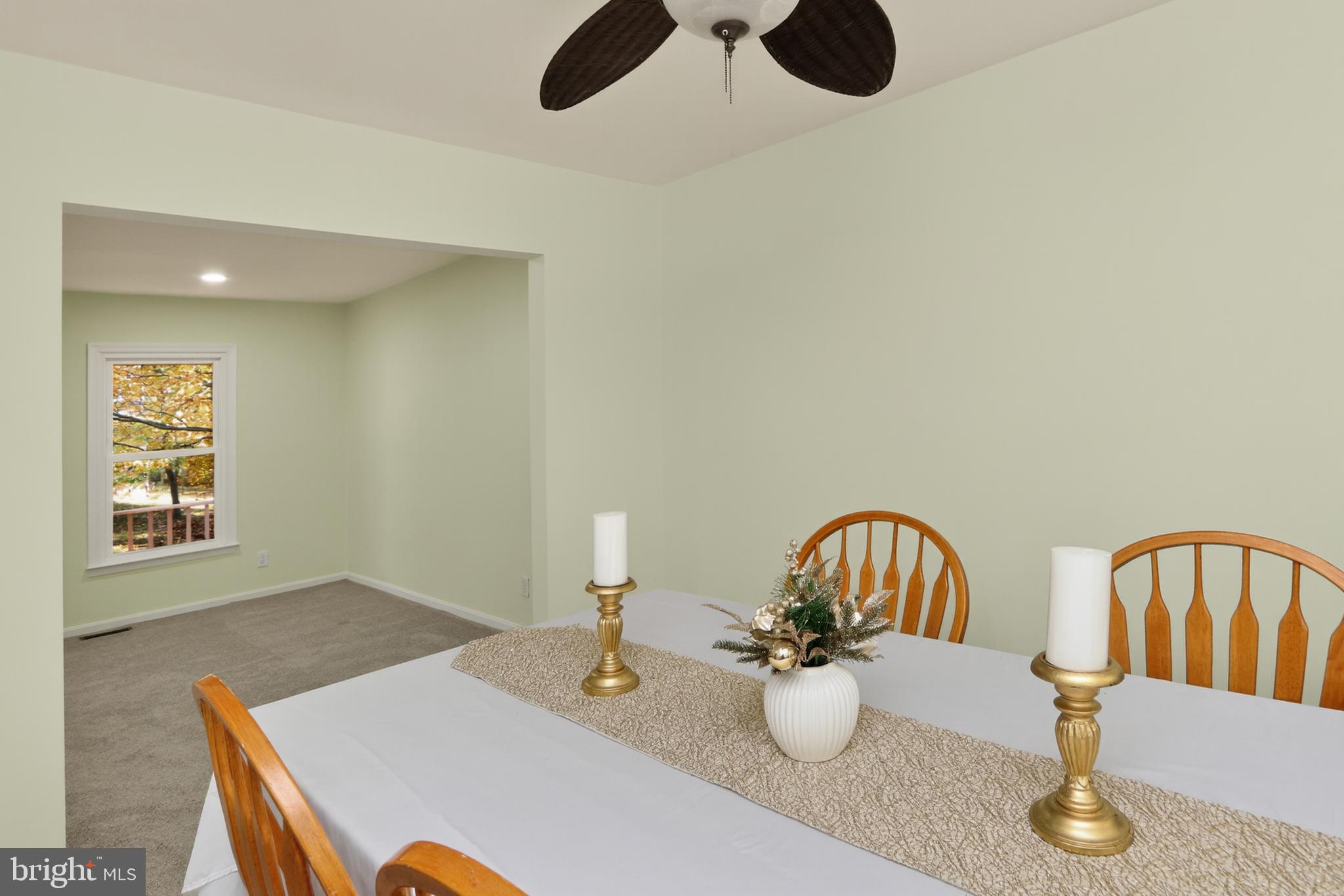 111 Oaklawn Road Stafford, VA 22554 - Photo 9 of 50 a dining room with two chairs and a table