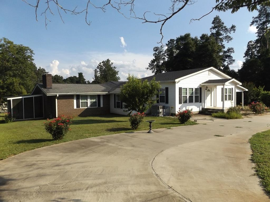 707 Ruby Street Jackson, SC 29831 - Photo 1 of 35 a front view of a house with a yard and garage
