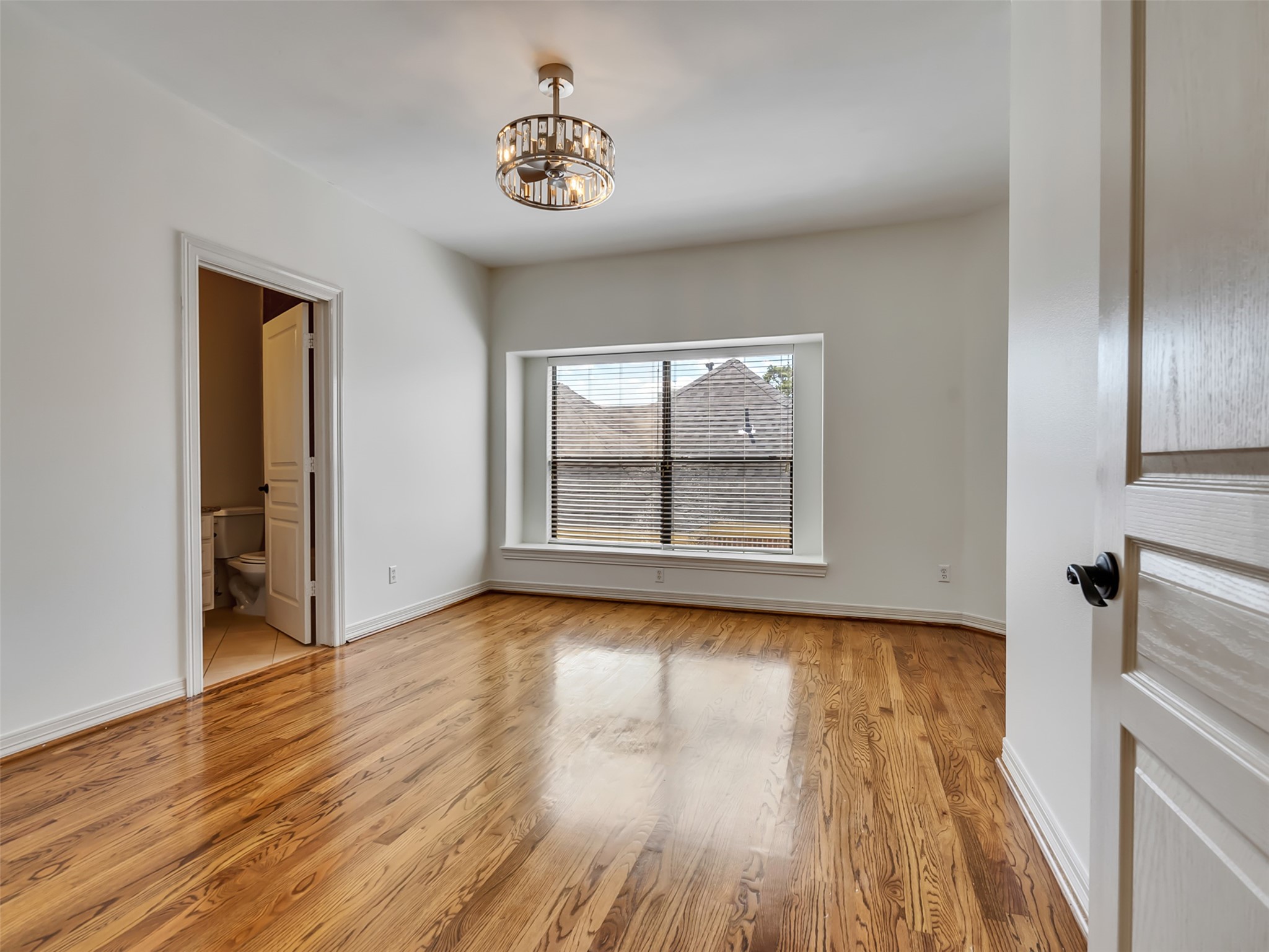2540 Prospect Street, Unit B Houston, TX 77004 - Photo 28 of 37 a view of an empty room with wooden floor and a window