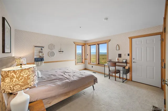 a bedroom with a bed and a table