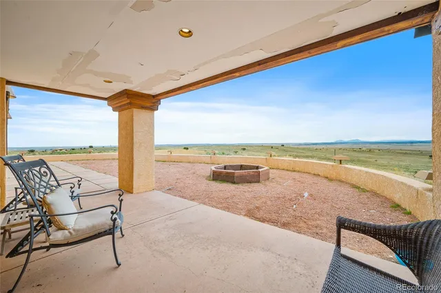 a view of swimming pool with outdoor seating