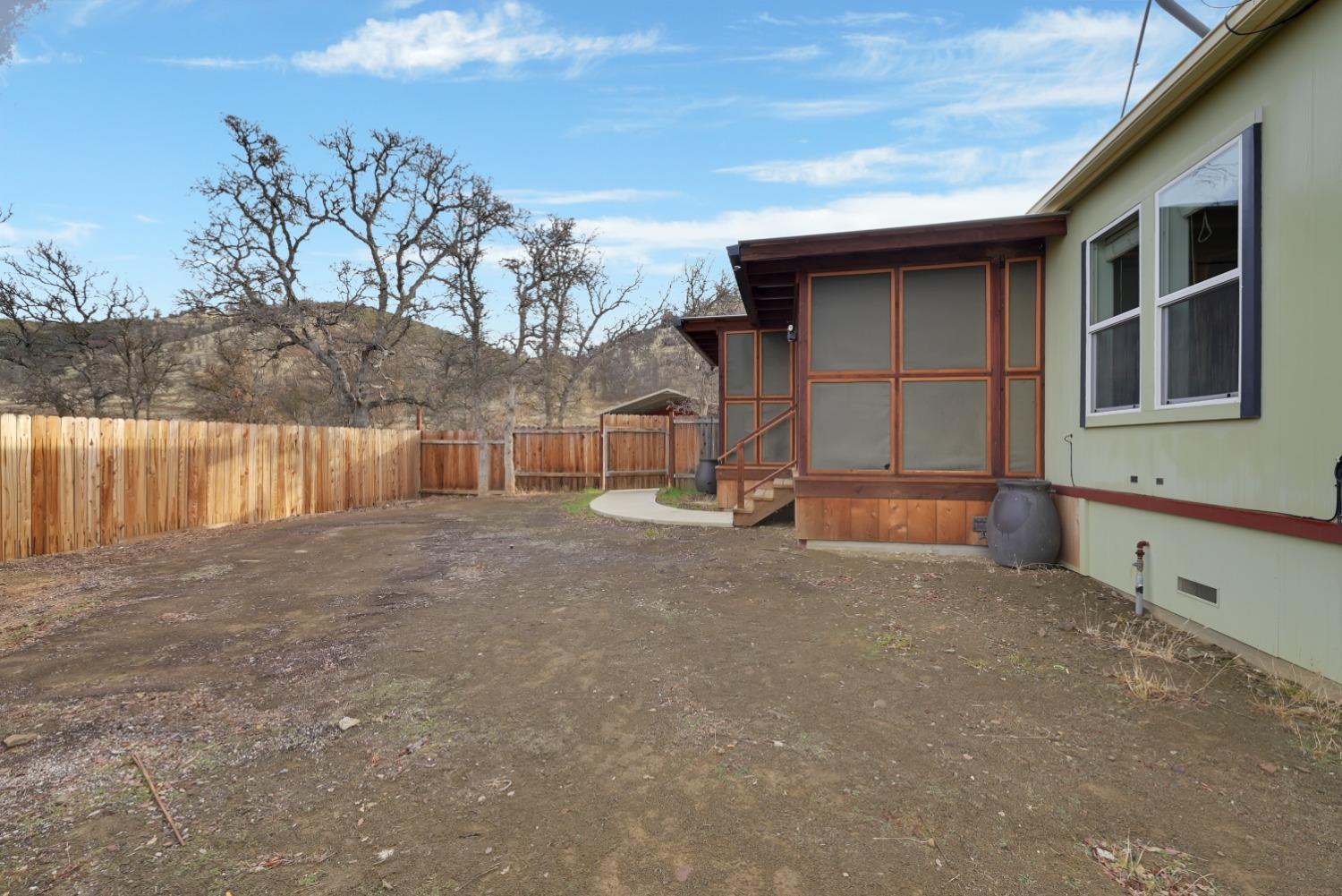 4485 Sites Lodoga Road Stonyford, CA 95979 - Photo 12 of 66 a view of backyard of house with wooden fence