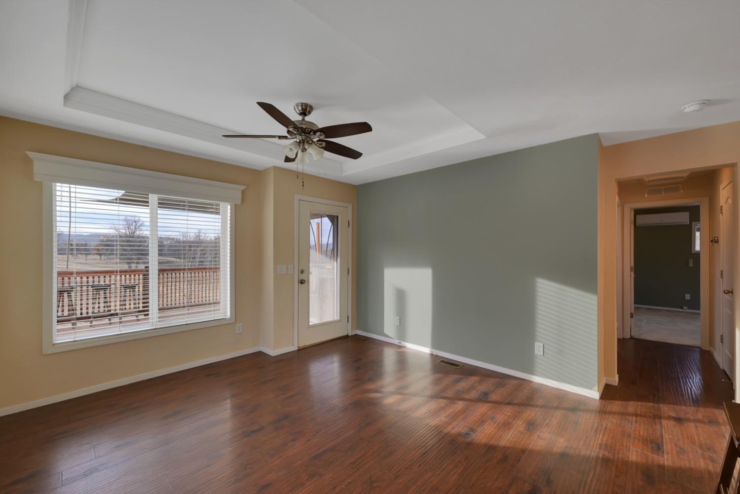 4485 Sites Lodoga Road Stonyford, CA 95979 - Photo 17 of 66 a view of an empty room with a window and wooden floor
