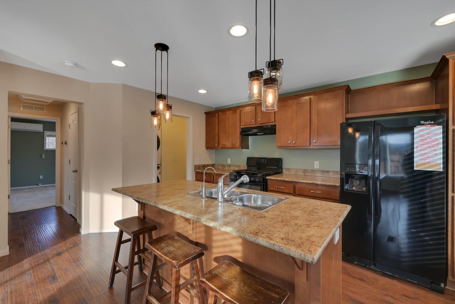 4485 Sites Lodoga Road Stonyford, CA 95979 - Photo 20 of 66 a kitchen with a table chairs refrigerator and microwave